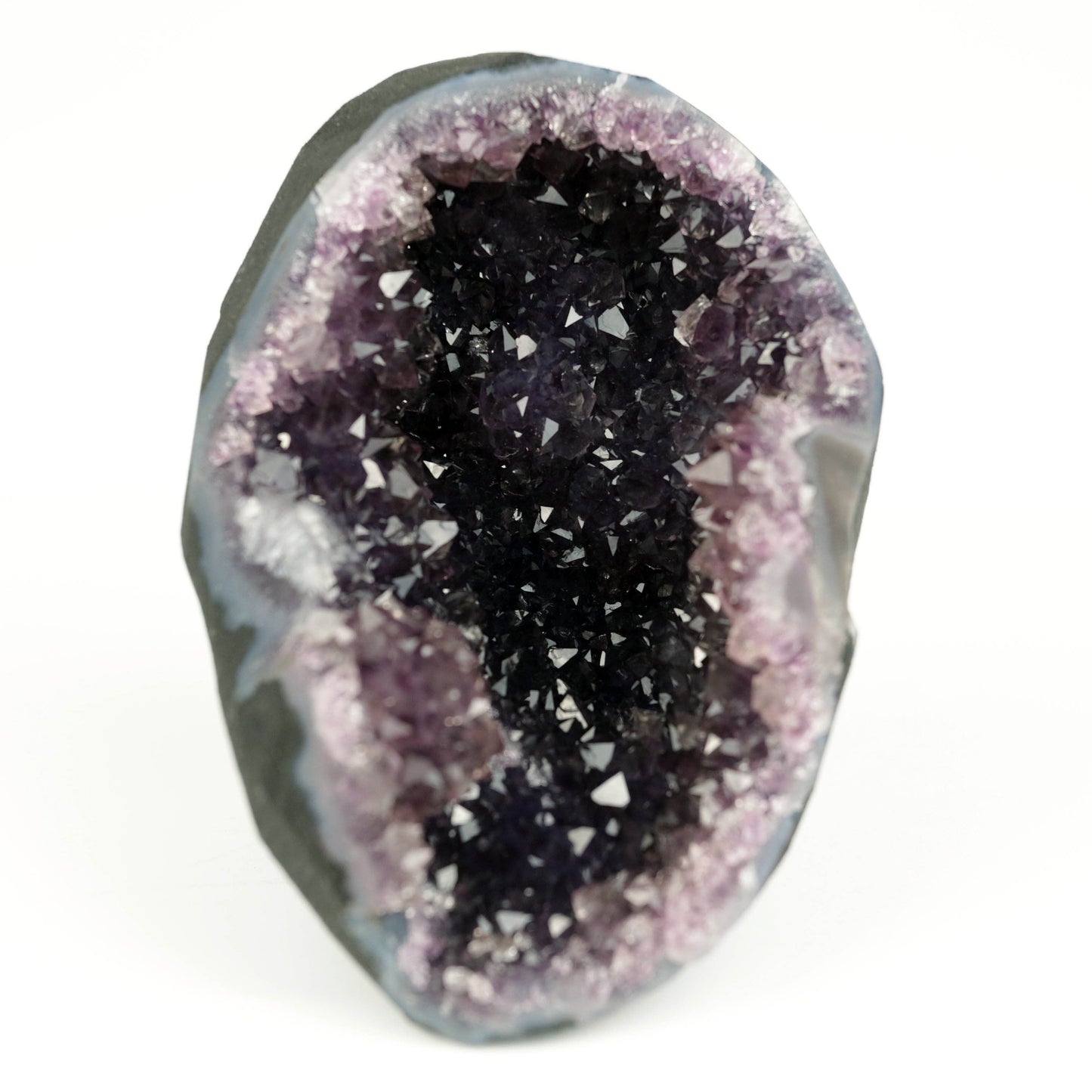 Amethyst Dark Purple Crystals Geode Natural Mineral Specimen # B 4645 https://www.superbminerals.us/products/amethyst-dark-purple-crystals-geode-natural-mineral-specimen-b-4645 Features: A Geode encrusted with beautiful, transparent Amethyst Quartz crystals in deep purple. Amethyst's vivid purple is unlike anything else on the market, and this piece is no exception. Aesthetic, with excellent colour and shine, and at a great price. It is in good shape. Primary Mineral(s): Amethyst