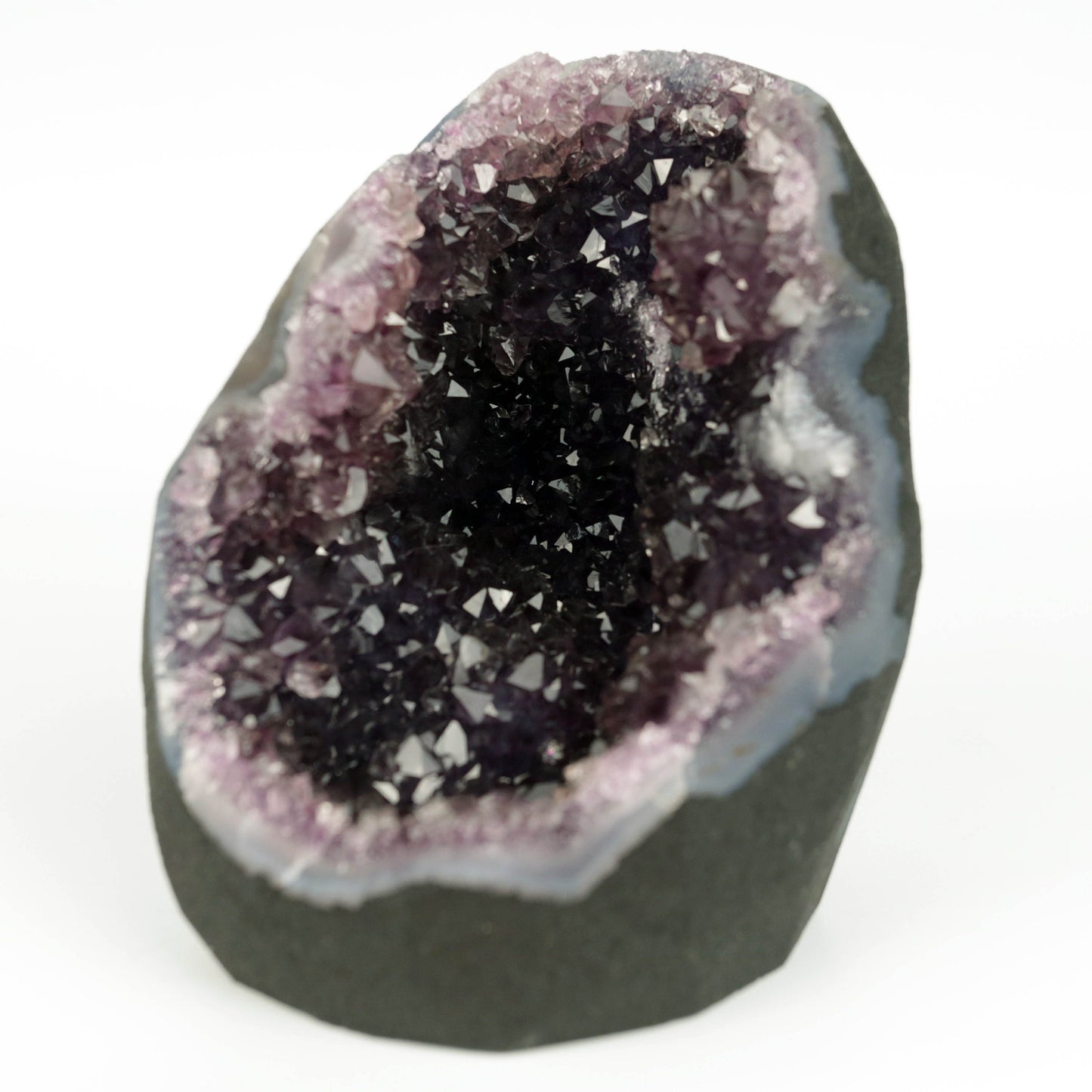 Amethyst Dark Purple Crystals Geode Natural Mineral Specimen # B 4645 https://www.superbminerals.us/products/amethyst-dark-purple-crystals-geode-natural-mineral-specimen-b-4645 Features: A Geode encrusted with beautiful, transparent Amethyst Quartz crystals in deep purple. Amethyst's vivid purple is unlike anything else on the market, and this piece is no exception. Aesthetic, with excellent colour and shine, and at a great price. It is in good shape. Primary Mineral(s): Amethyst