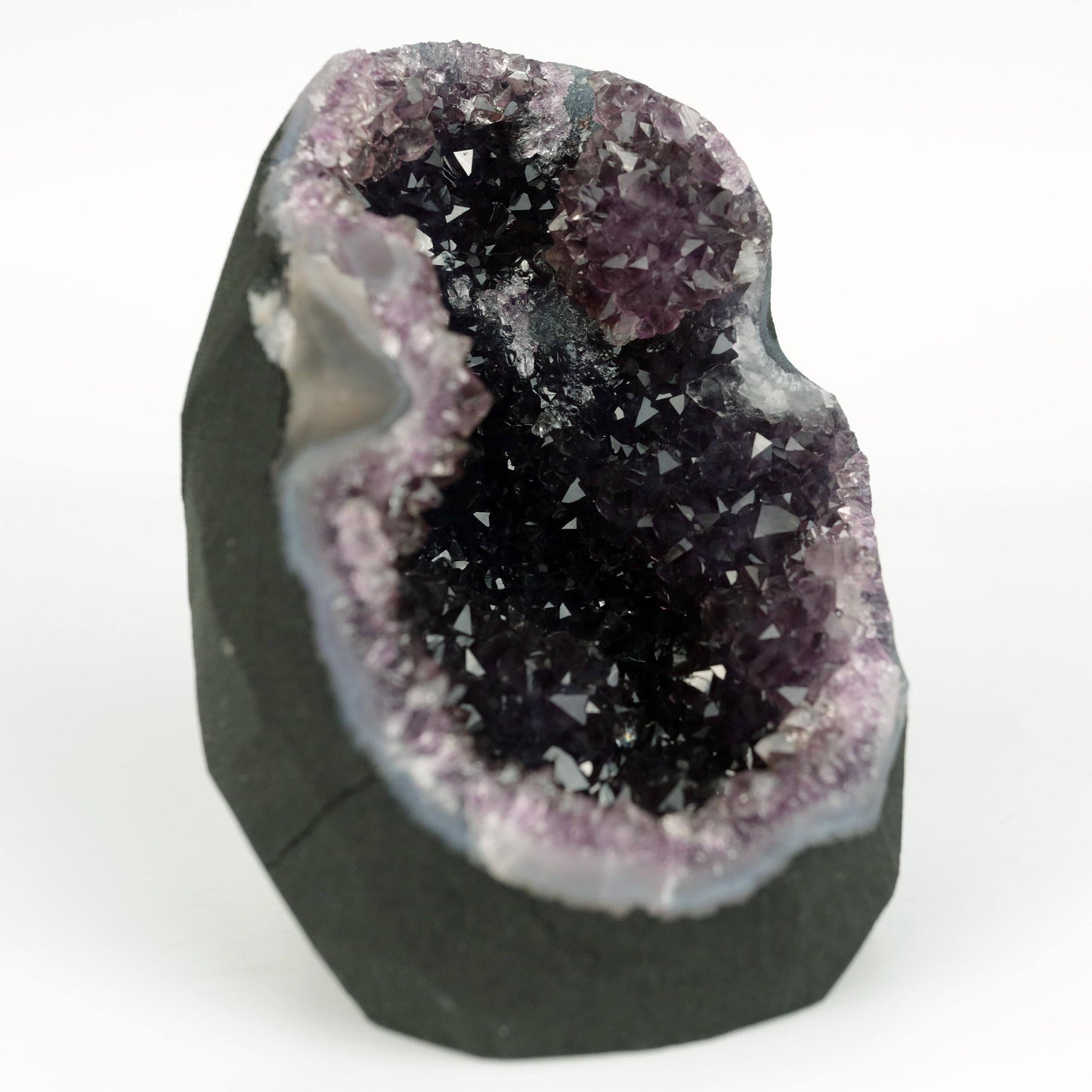 Amethyst Dark Purple Crystals Geode Natural Mineral Specimen # B 4645 https://www.superbminerals.us/products/amethyst-dark-purple-crystals-geode-natural-mineral-specimen-b-4645 Features: A Geode encrusted with beautiful, transparent Amethyst Quartz crystals in deep purple. Amethyst's vivid purple is unlike anything else on the market, and this piece is no exception. Aesthetic, with excellent colour and shine, and at a great price. It is in good shape. Primary Mineral(s): Amethyst