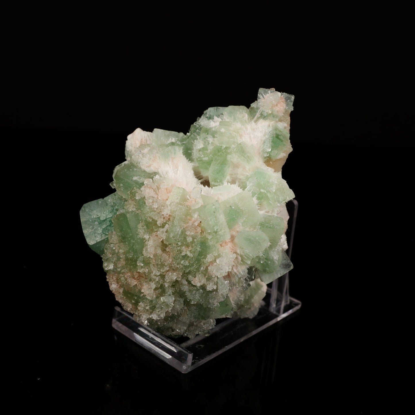 Apophyllite Cubes green Natural Mineral Specimen # B 5549 https://www.superbminerals.us/products/apophyllite-cubes-green-natural-mineral-specimen-b-5549 Features:Primary Mineral(s): ApophylliteSecondary Mineral(s): N/AMatrix: N/ASize : 3 Inch x 4 InchWeight : 271 GmsLocality: Nashik , Maharashtra, India Fluorapophyllite crystals with peach Stilbite crystals on minor matrix from Nashik, excellent grade, sharp, glossy and doubly terminated.