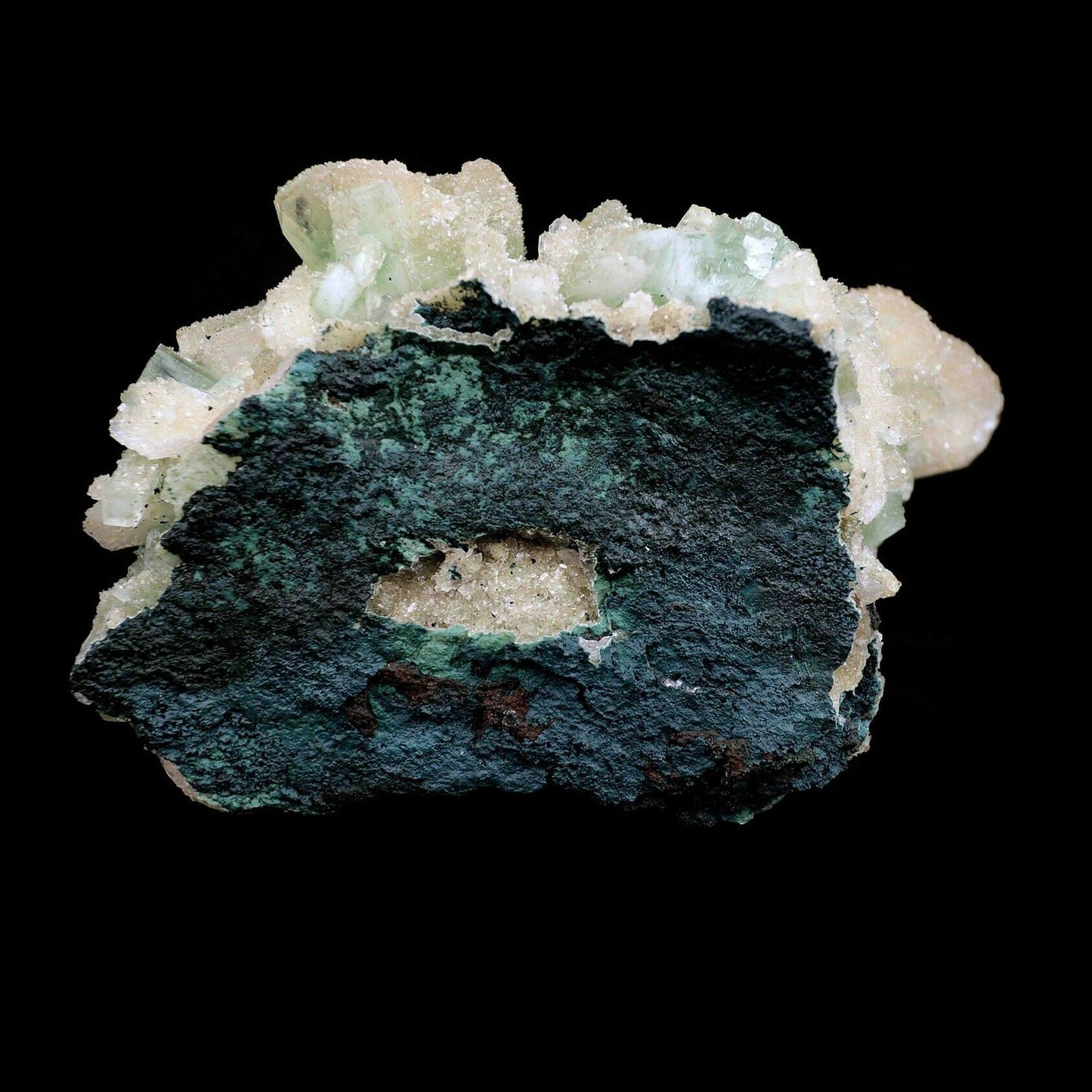 Apophyllite Green Crystal with Stilbite Natural Mineral Specimen # B 3571 https://www.superbminerals.us/products/apophyllite-green-crystal-with-stilbite-natural-mineral-specimen-b-3571 An extremely stylish piece that that is covered with light green Apophyllite precious stones. Set among the Apophyllite gems are various Stilbite gems, a few having a "tie" precious stone development. The silvery shine of this piece is extraordinary. You will see some uncovered lattice of beige-shaded microcry