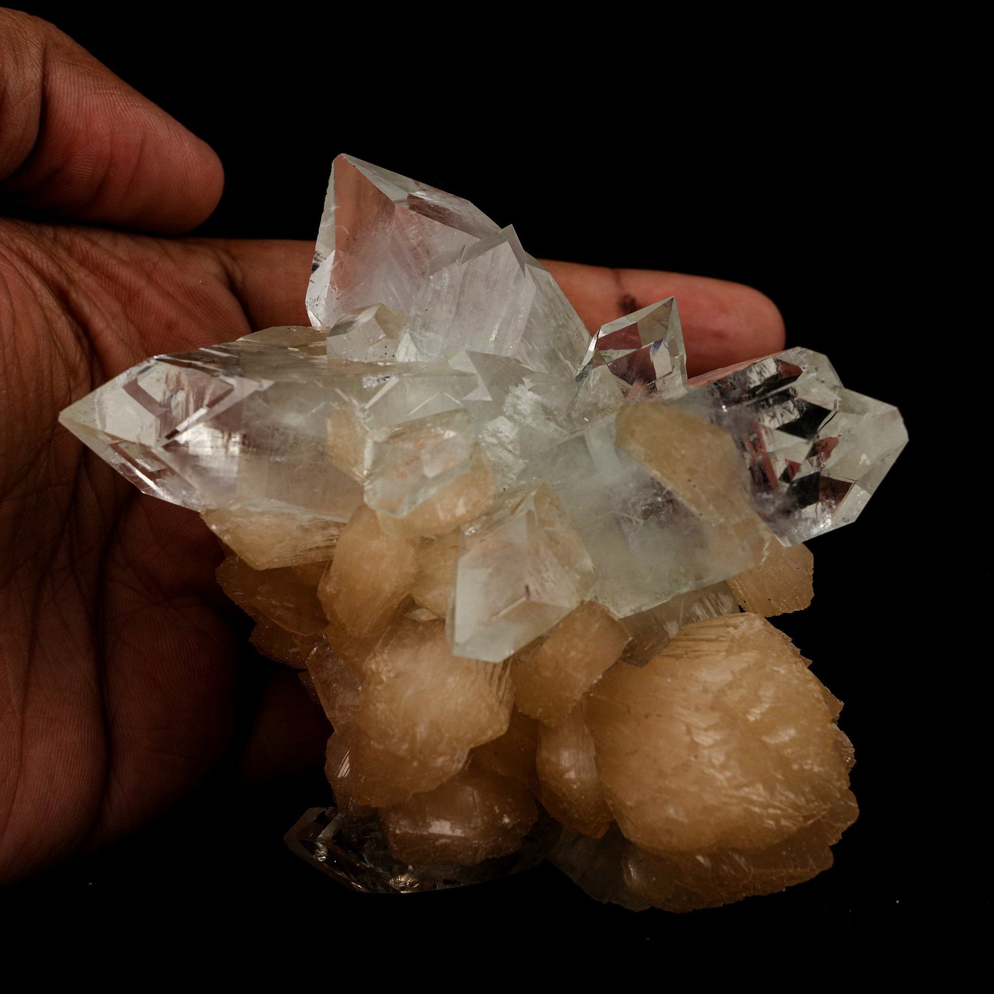 Apophyllite Pointed with Stilbite Natural Mineral Specimen # B 5098 https://www.superbminerals.us/products/apophyllite-pointed-with-stilbite-natural-mineral-specimen-b-5098 Features: A classic and aesthetic display specimen featuring sharp, lustrous, very well-formed, beautiful orange-peach colored, thick "sword"-shaped sheaf-like crystals of Stilbite across sitting atop of Apophyllite matrix with a distinct pinkish coloring internally. The main Stilbite crystal is doubly