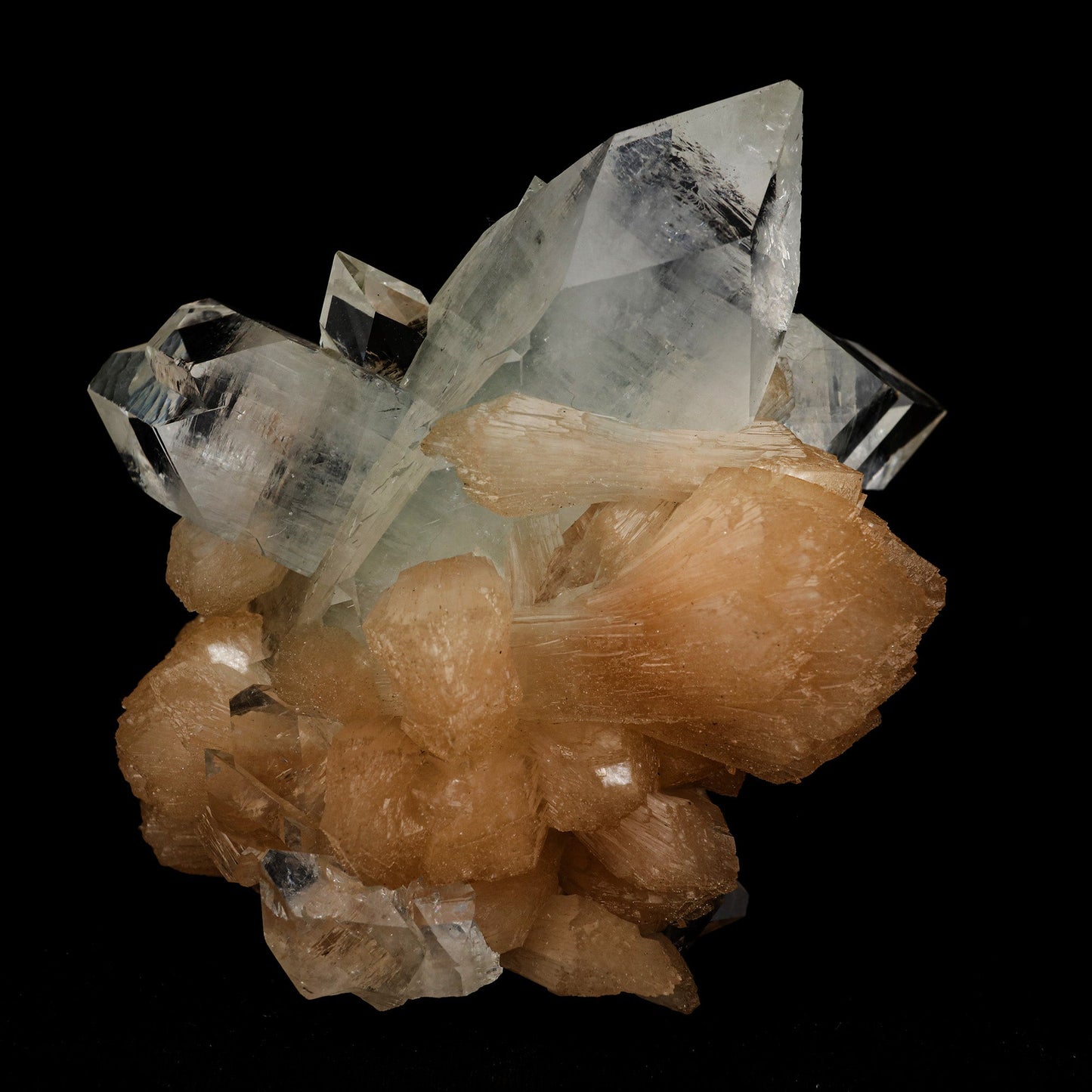 Apophyllite Pointed with Stilbite Natural Mineral Specimen # B 5098 https://www.superbminerals.us/products/apophyllite-pointed-with-stilbite-natural-mineral-specimen-b-5098 Features: A classic and aesthetic display specimen featuring sharp, lustrous, very well-formed, beautiful orange-peach colored, thick "sword"-shaped sheaf-like crystals of Stilbite across sitting atop of Apophyllite matrix with a distinct pinkish coloring internally. The main Stilbite crystal is doubly