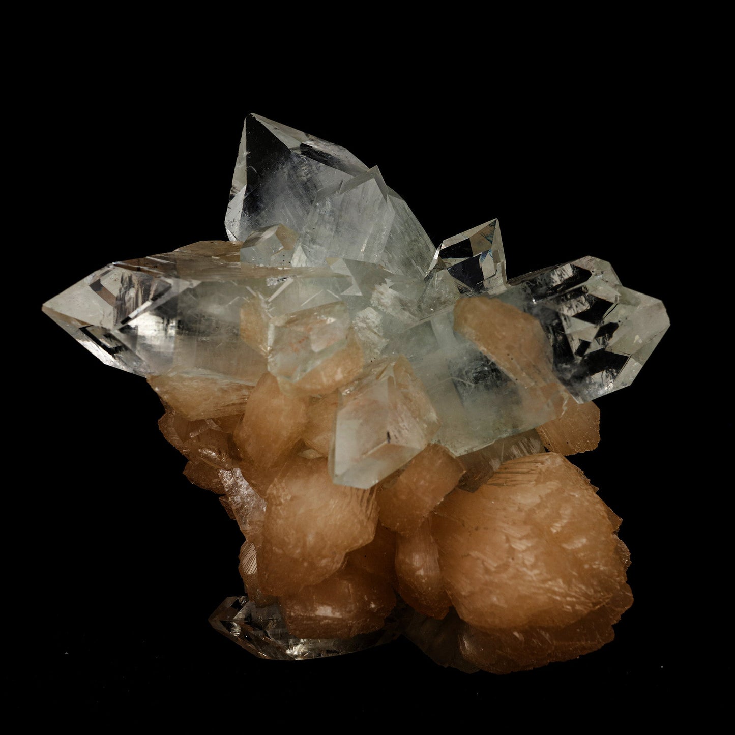 Apophyllite Pointed with Stilbite Natural Mineral Specimen # B 5098 https://www.superbminerals.us/products/apophyllite-pointed-with-stilbite-natural-mineral-specimen-b-5098 Features: A classic and aesthetic display specimen featuring sharp, lustrous, very well-formed, beautiful orange-peach colored, thick "sword"-shaped sheaf-like crystals of Stilbite across sitting atop of Apophyllite matrix with a distinct pinkish coloring internally. The main Stilbite crystal is doubly