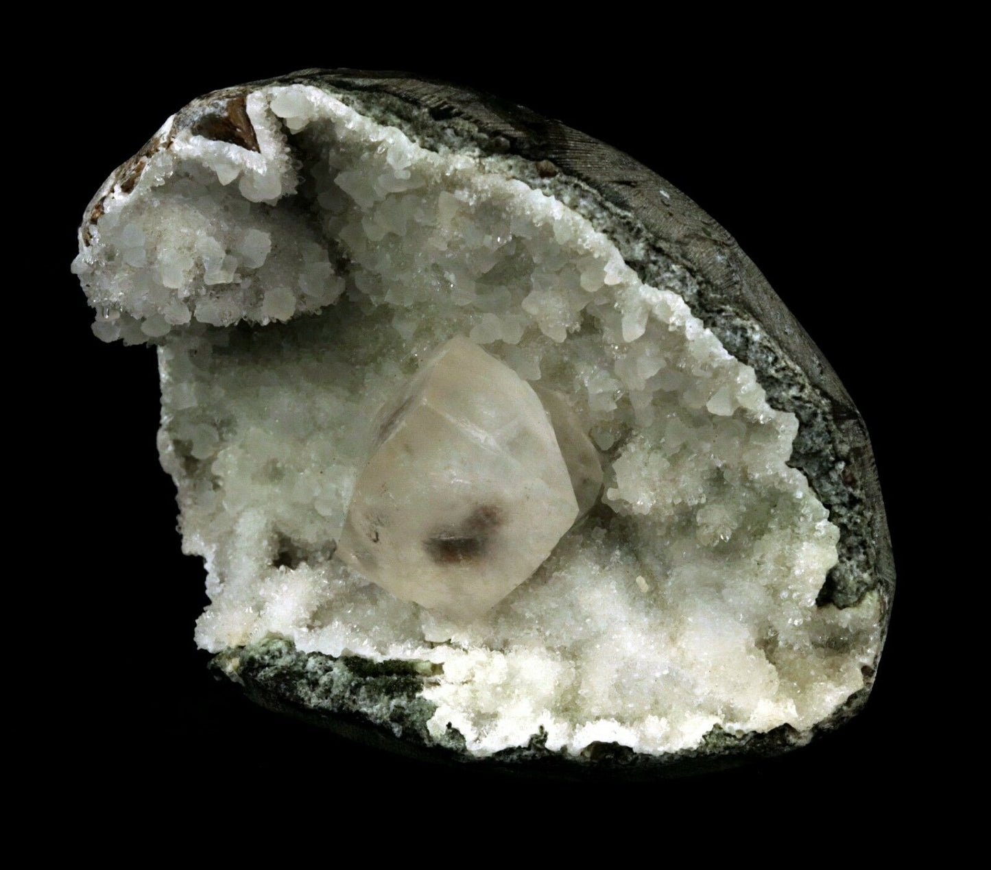 Calcite Cube inside MM Quartz Geode Natural Minerals Specimen # B 2490 https://www.superbminerals.us/products/calcite-cube-inside-mm-quartz-geode-natural-minerals-specimen-b-2490 Features: This is a superb piece that features an exceptionally large Geode lined with lustrous, colorless microcrystalline MM Quartz and MM Quartz hosting one large, translucent Calcite cube. The cube is flawless the result of being protected within a Geode and are perfectly positioned to give the piece outstanding