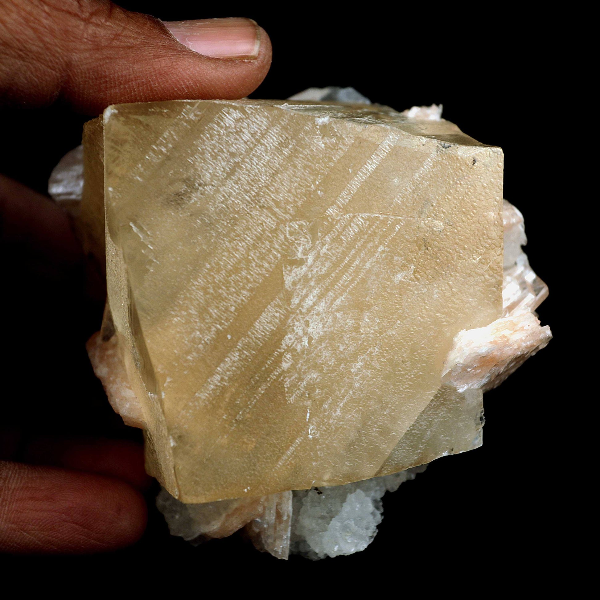 Calcite Cube with Stilbite, MM Quartz Natural Mineral Specimen # B 403…  https://www.superbminerals.us/products/calcite-cube-with-stilbite-mm-quartz-natural-mineral-specimen-b-4030  Features:A dazzling and wonderful gemmy Calcite cubic precious crystal from the Nashik locale in Maharashtra, India. The precious stone is a twisted rhombohedron, tending to practically cubic and measures cubic gems, one arising out of the top face and one further down. The gems are straightforward, absolutely gemmy