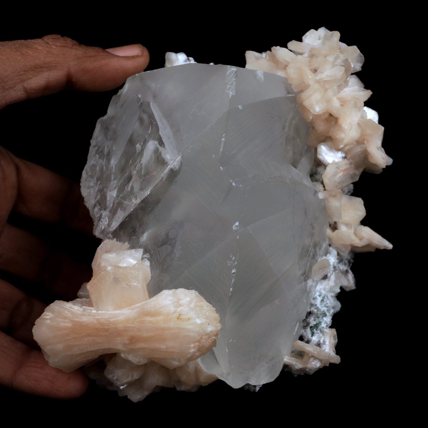 Calcite with Stilbite Natural Mineral Specimen (Repaired) # B 3904 https://www.superbminerals.us/products/calcite-with-stilbite-natural-mineral-specimen-repaired-b-3904 FeaturesA huge, delightful smooth white to smoky rhombohedral Calcite crystal, anxious, with crossing Stilbite crystals on a network of snow-white microcrystalline Quartz, with minor Apophyllite.