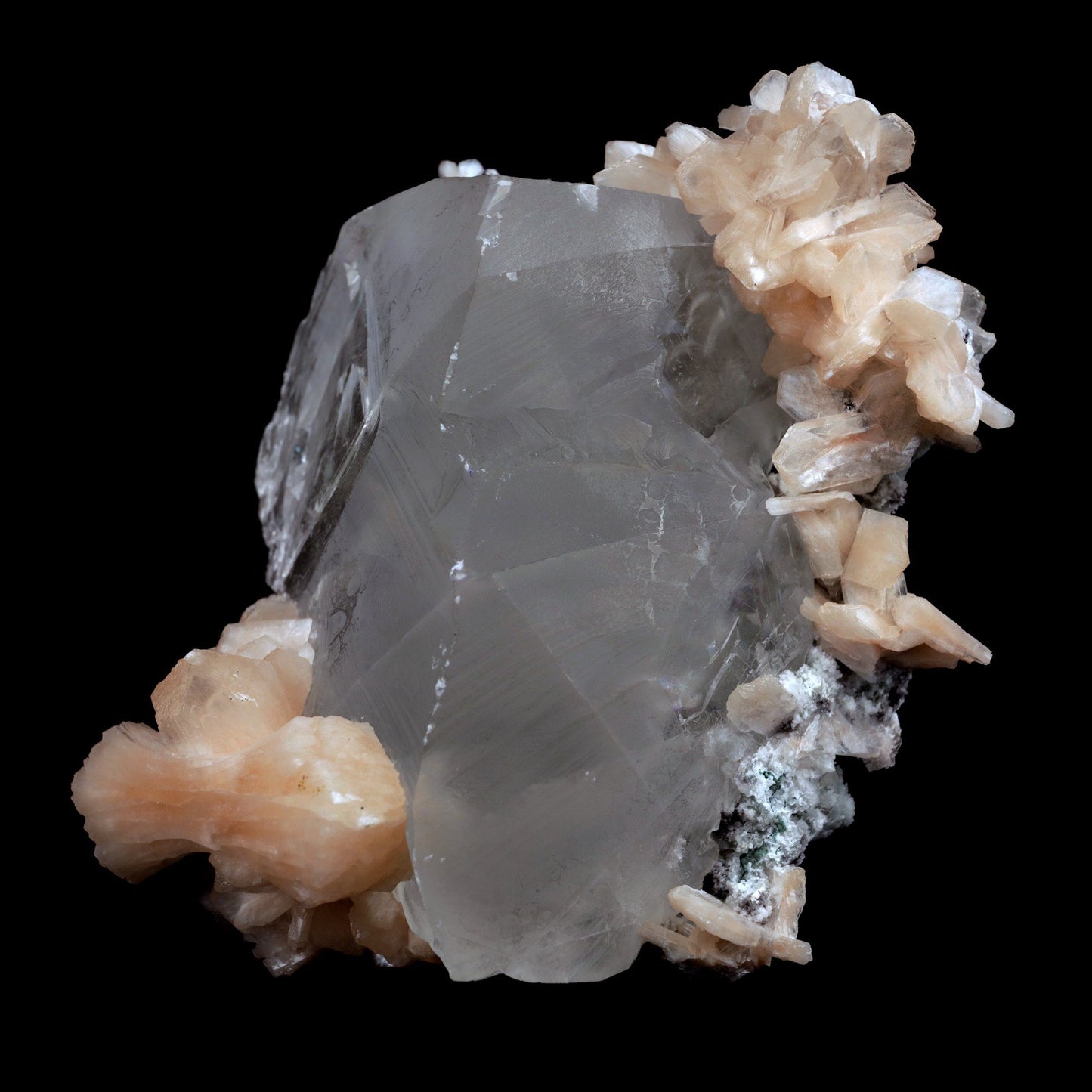 Calcite with Stilbite Natural Mineral Specimen (Repaired) # B 3904 https://www.superbminerals.us/products/calcite-with-stilbite-natural-mineral-specimen-repaired-b-3904 FeaturesA huge, delightful smooth white to smoky rhombohedral Calcite crystal, anxious, with crossing Stilbite crystals on a network of snow-white microcrystalline Quartz, with minor Apophyllite.