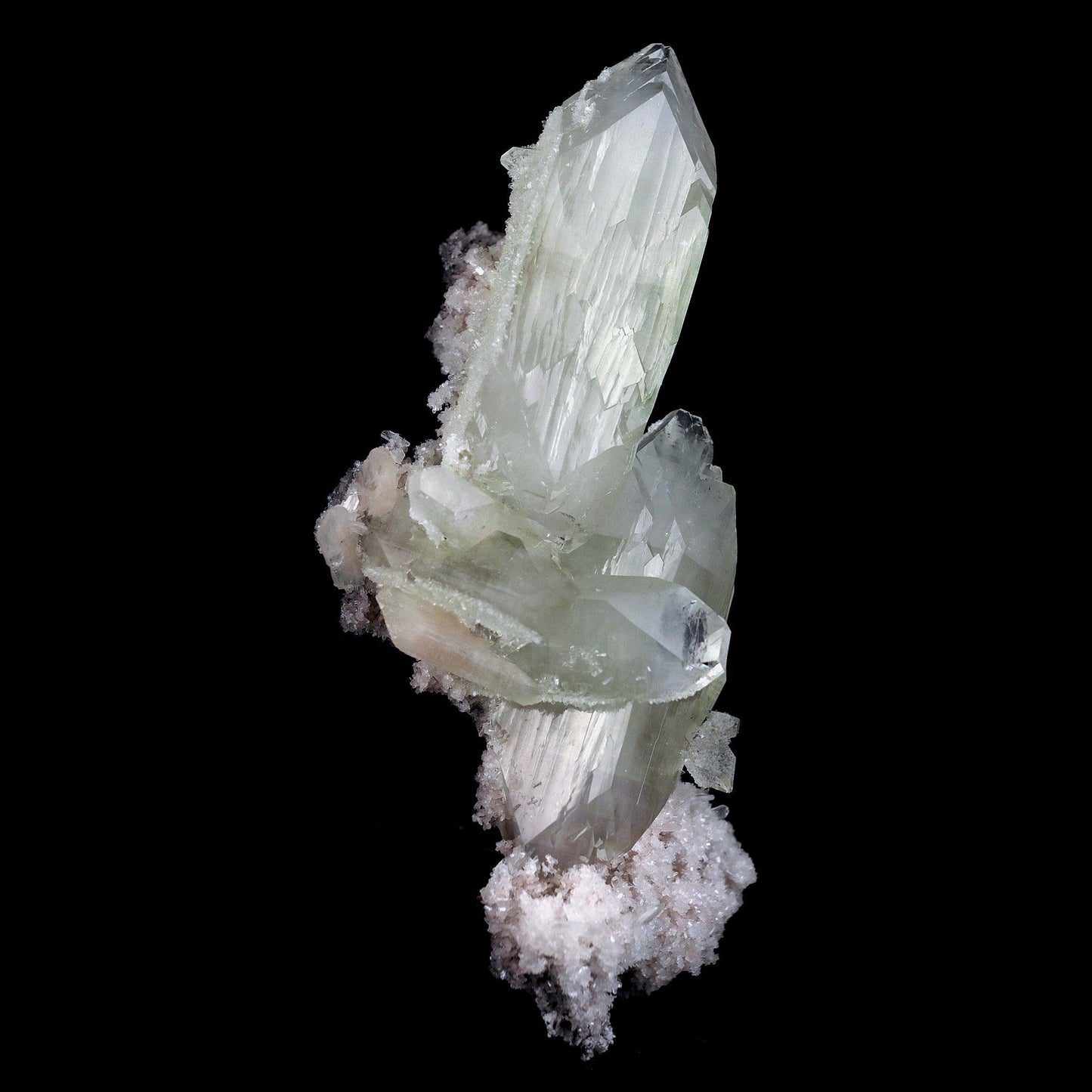 Doubly Terminated Fluro Apophyllite On Chalcedony Natural Mineral Spec… https://www.superbminerals.us/products/doubly-terminated-fluro-apophyllite-on-chalcedony-natural-mineral-specimen-b-4429 Features: Fantastic two toned, very glassy tetragonal apophyllite crystals with remarkable water-clear, gem, highly modified pinacoidal terminations around translucent bodies form a beautiful architectural stalactite from Jalgaon. The crowning crystal has a length of 5.5 cm.The silica-rich precipitated fluids