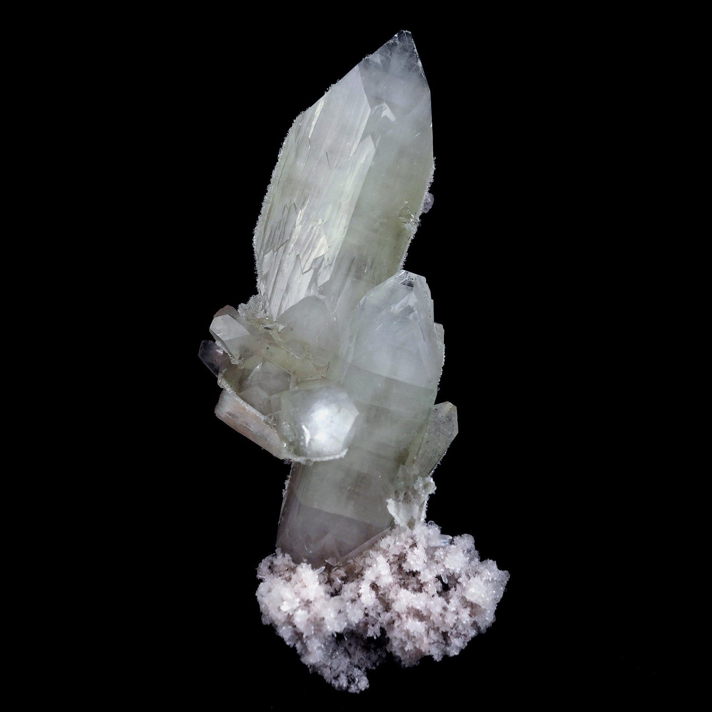 Doubly Terminated Fluro Apophyllite On Chalcedony Natural Mineral Spec… https://www.superbminerals.us/products/doubly-terminated-fluro-apophyllite-on-chalcedony-natural-mineral-specimen-b-4429 Features: Fantastic two toned, very glassy tetragonal apophyllite crystals with remarkable water-clear, gem, highly modified pinacoidal terminations around translucent bodies form a beautiful architectural stalactite from Jalgaon. The crowning crystal has a length of 5.5 cm.The silica-rich precipitated fluids