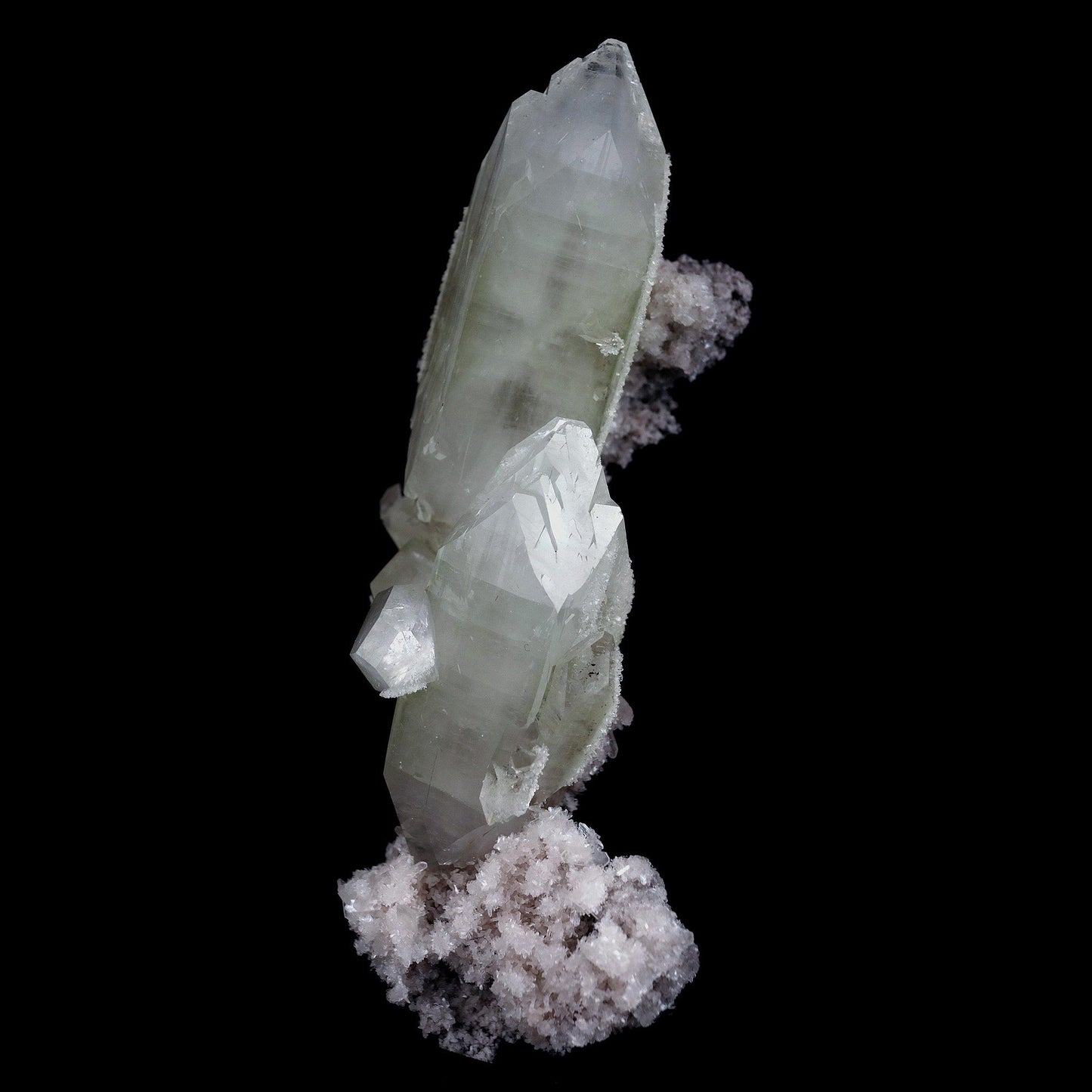 Doubly Terminated Fluro Apophyllite On Chalcedony Natural Mineral Spec… https://www.superbminerals.us/products/doubly-terminated-fluro-apophyllite-on-chalcedony-natural-mineral-specimen-b-4429 Features: Fantastic two toned, very glassy tetragonal apophyllite crystals with remarkable water-clear, gem, highly modified pinacoidal terminations around translucent bodies form a beautiful architectural stalactite from Jalgaon. The crowning crystal has a length of 5.5 cm.The silica-rich precipitated fluids
