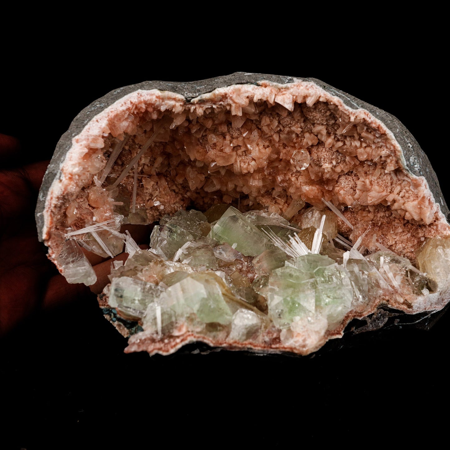 Green Apophyllite Crystals Inside Heulandite Geode Natural Mineral Spe… https://www.superbminerals.us/products/green-apophyllite-crystals-inside-heulandite-geode-natural-mineral-specimen-b-5254 Features: This beautiful display specimen is a feast of color, texture, and reflections of light. Apophyllite crystals have a high luster on their sides, which contrasts beautifully with their flat, pearl-like terminations. Several acicular sprays of colorless to white, satin and Scolecite. Through the Apophyllite