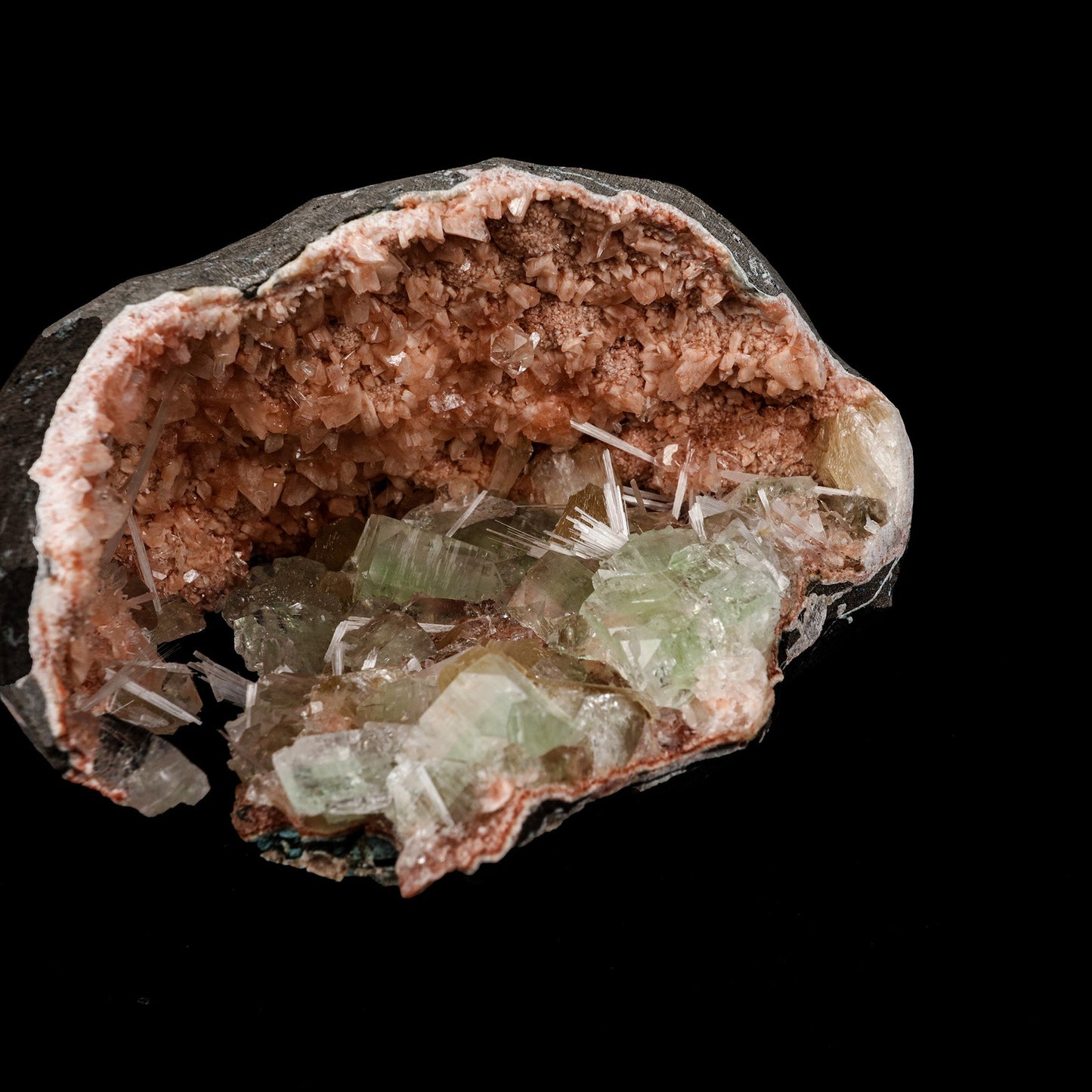 Green Apophyllite Crystals Inside Heulandite Geode Natural Mineral Spe… https://www.superbminerals.us/products/green-apophyllite-crystals-inside-heulandite-geode-natural-mineral-specimen-b-5254 Features: This beautiful display specimen is a feast of color, texture, and reflections of light. Apophyllite crystals have a high luster on their sides, which contrasts beautifully with their flat, pearl-like terminations. Several acicular sprays of colorless to white, satin and Scolecite. Through the Apophyllite