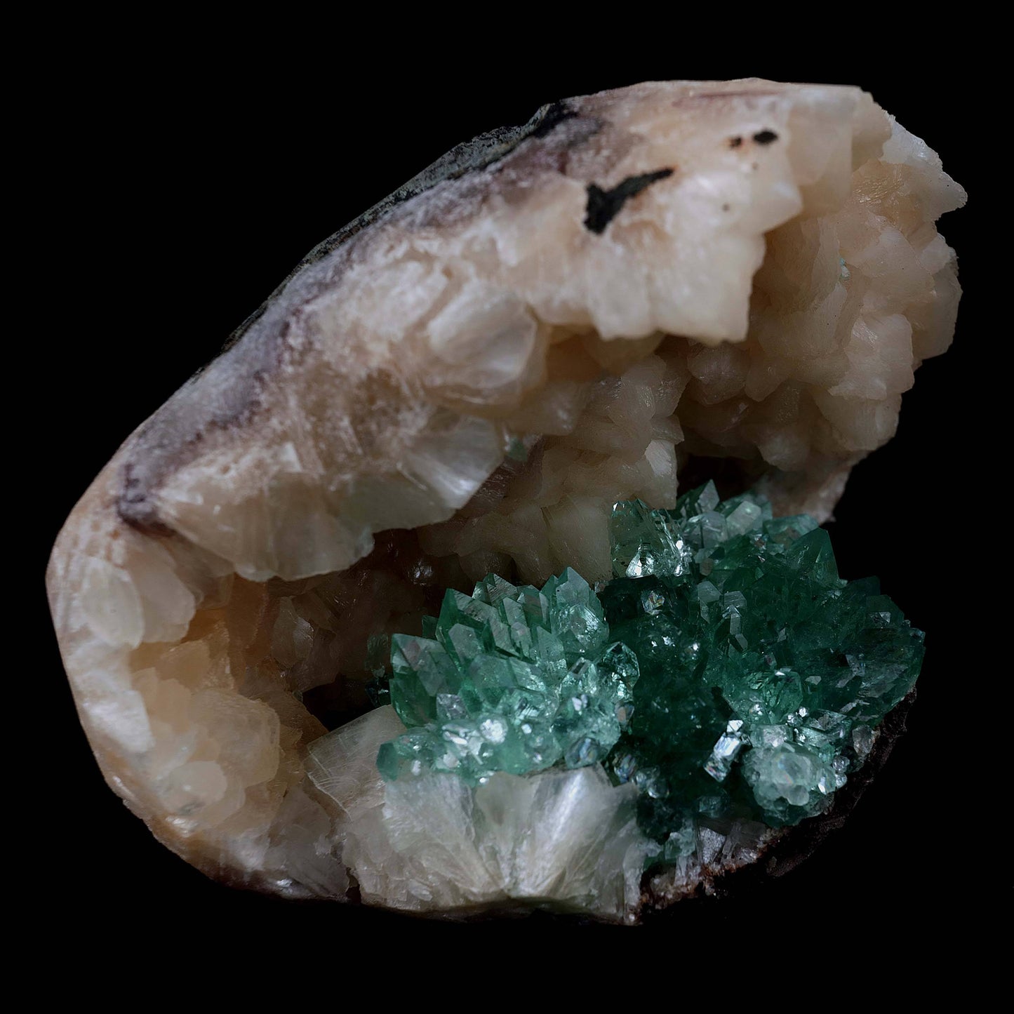 Green Apophyllite with Stilbite Natural Mineral Specimen # B 3986 https://www.superbminerals.us/products/green-apophyllite-with-stilbite-natural-mineral-specimen-b-3986 Features Transparent green apophyllite crystals up to 10-15 mm long with lustrous crystal faces and steep pyramidal terminations, on matrix covered with lustrous peach-baggie colored Stilbite crystals up to mixed size. Primary Mineral(s): Apophyllite Secondary Mineral(s): Stilbite