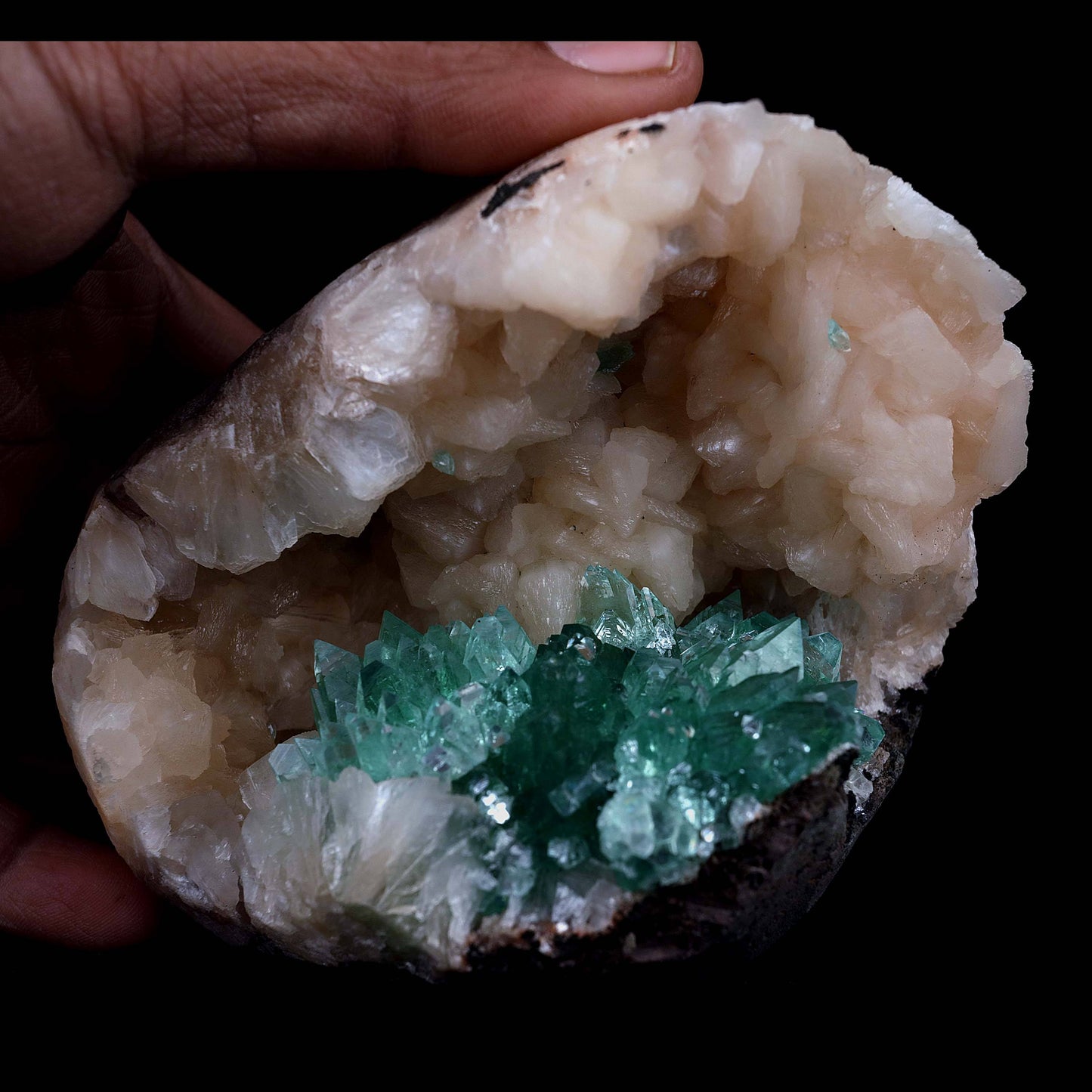 Green Apophyllite with Stilbite Natural Mineral Specimen # B 3986 https://www.superbminerals.us/products/green-apophyllite-with-stilbite-natural-mineral-specimen-b-3986 Features Transparent green apophyllite crystals up to 10-15 mm long with lustrous crystal faces and steep pyramidal terminations, on matrix covered with lustrous peach-baggie colored Stilbite crystals up to mixed size. Primary Mineral(s): Apophyllite Secondary Mineral(s): Stilbite
