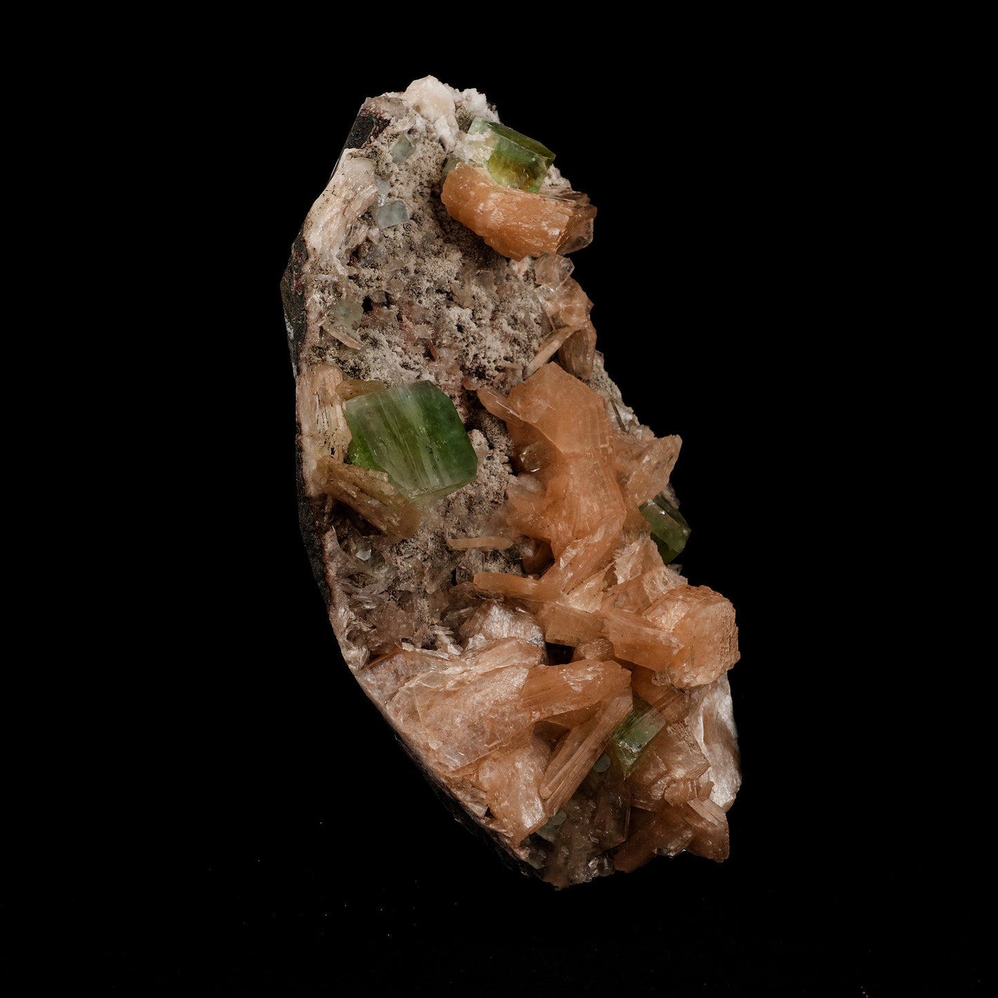 Green Apophyllite with Stilbite Natural Mineral Specimen # B 5090 https://www.superbminerals.us/products/green-apophyllite-with-stilbite-natural-mineral-specimen-b-5090 Features: A very aesthetic piece featuring a matrix densely coated with miniature, beige Stilbite crystals with a cluster of lustrous, larger light-beige Stilbite crystals at the base, all hosting a crown of transparent, mint-green Apophyllite pseudocubic (rectangular) crystals. Great contrast, color, symmetry