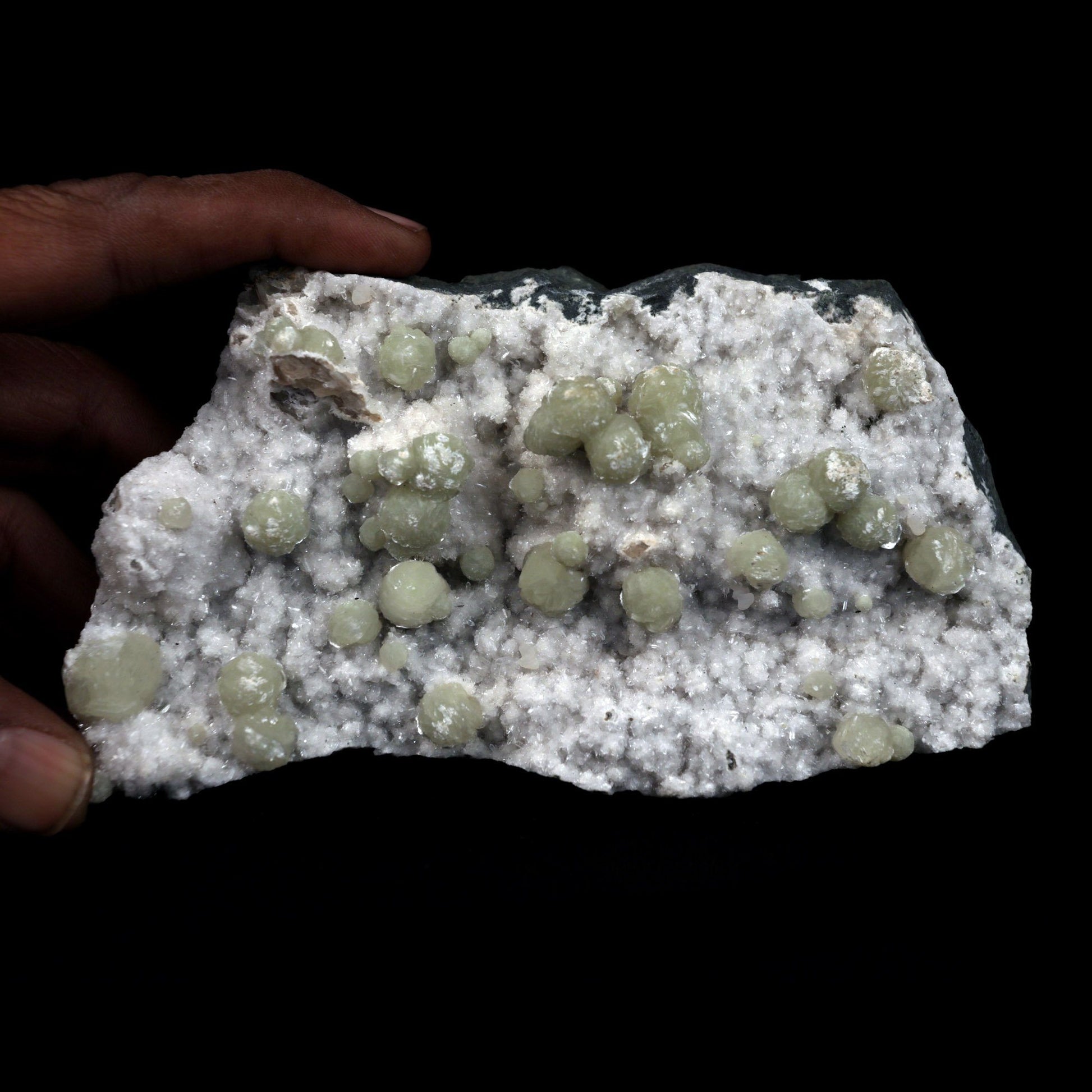 Gyrolite Balls on Chalcedony Natural Mineral Specimen # B 4898  https://www.superbminerals.us/products/gyrolite-balls-on-chalcedony-natural-mineral-specimen-b-4898  Features: Magnificent gyrolite balls scattered throughout a chalcedony matrix.extremely interesting item to have in one's collection Primary Mineral(s): GyroliteSecondary Mineral(s): N/AMatrix: Chalcedony