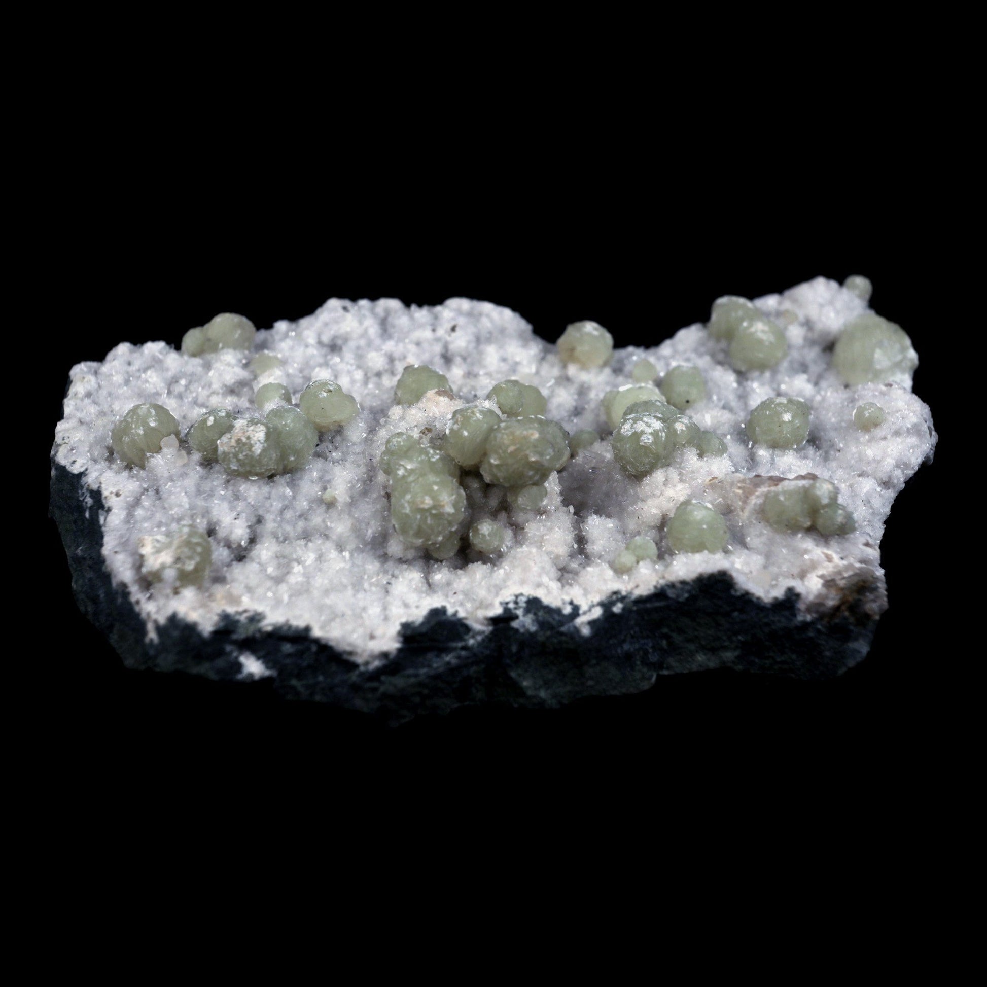 Gyrolite Balls on Chalcedony Natural Mineral Specimen # B 4898  https://www.superbminerals.us/products/gyrolite-balls-on-chalcedony-natural-mineral-specimen-b-4898  Features: Magnificent gyrolite balls scattered throughout a chalcedony matrix.extremely interesting item to have in one's collection Primary Mineral(s): GyroliteSecondary Mineral(s): N/AMatrix: Chalcedony