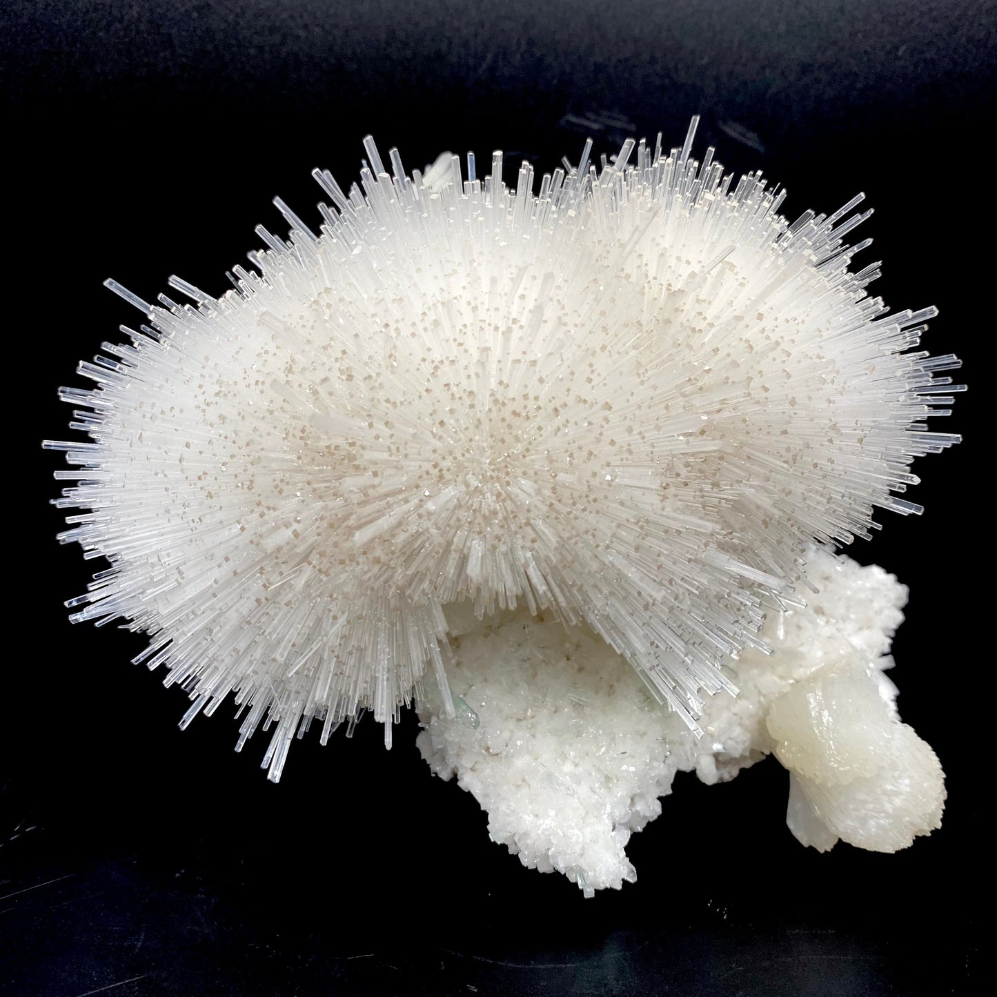 Truly impressive mesolite needles in a gorgeous hemispherical porcupine quill spray, formed with stilbite and green apophyllite on a mordenite matrix. Very delicate museum-grade specimen.