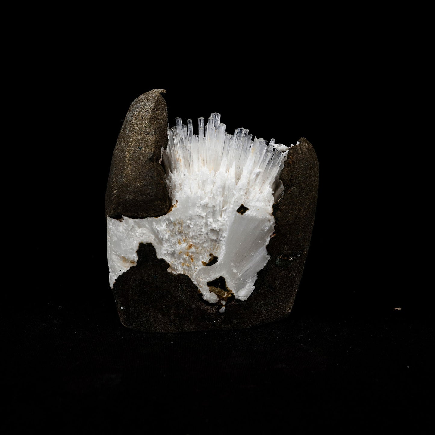 Natrolite Sprays Inside Chalcedony Geode Natural Mineral Specimen # B… https://www.superbminerals.us/products/natrolite-sprays-inside-chalcedony-geode-natural-mineral-specimen-b-5160 Features: Aesthetically situated in completely hollow basaltic vug, a diverging spray of gemmy, lustrous, Natrolite crystals to 3.5 inch in length emanate from a druse of sugary white Chalcedony. Although a few Natrolite crystals do span the vug and are attached to the ceiling, the majority are visibly terminated.