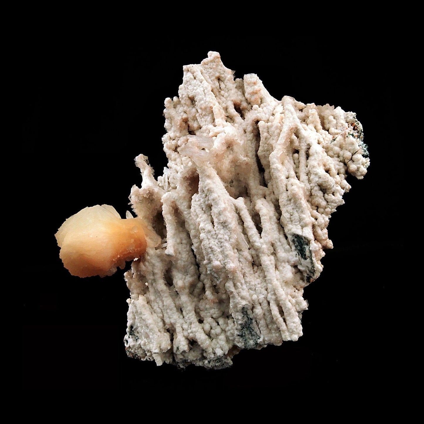 Pink Stilbite Crystal on Chalcedony Natural Coral Formation # B 2603 his is an intergrown group of lustrous, translucent, terra-cotta colored Stilbite on Chalcedony natural coral formation. Primary Mineral(s): Stilbite Secondary Mineral(s): N/AMatrix: Chalcedony19 cm x 14 cm750 GmsLocality: Aurangabad, Maharashtra, IndiaYear of Discovery: 2018