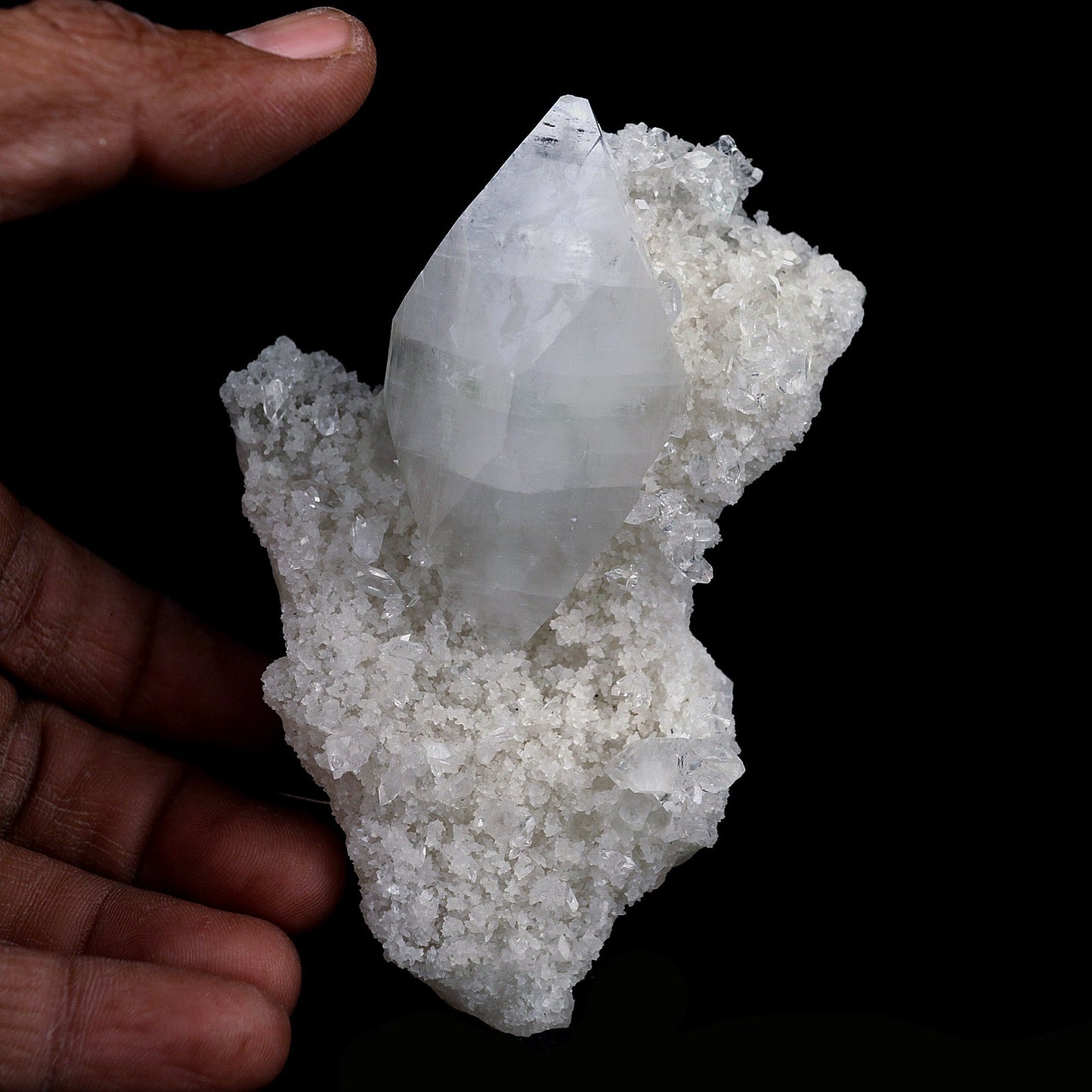 Pointed Apophyllite Crystal on Chalcedony Natural Mineral Specimen # B… https://www.superbminerals.us/products/pointed-apophyllite-crystal-on-chalcedony-natural-mineral-specimen-b-4120 Features:One big intersecting doubly-terminated crystal of colorless Apophyllite perched on small plate of white chalcedony Microcrystals. The tip of the smaller crystal is cleaved with a clean surface. Primary Mineral(s): ApophylliteSecondary Mineral(s): StilbiteMatrix: N/A10 cm x 6 cm 150 GmsLocality: Jalgaon