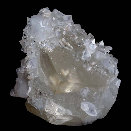 Pseudo Calcite with Apophyllite Natural Mineral Specimen # B 4632  https://www.superbminerals.us/products/pseudo-calcite-with-apophyllite-natural-mineral-specimen-b-4632  Features: Truly exceptional combination piece with with one of the finest Indian Calcites, lustrous Apophyllite. The centerpiece Calcite is a stunning on the front edge, with superb luster and excellent gemminess. The front edge is also the main twinning plane. What makes the Calcite itself even more exceptional 