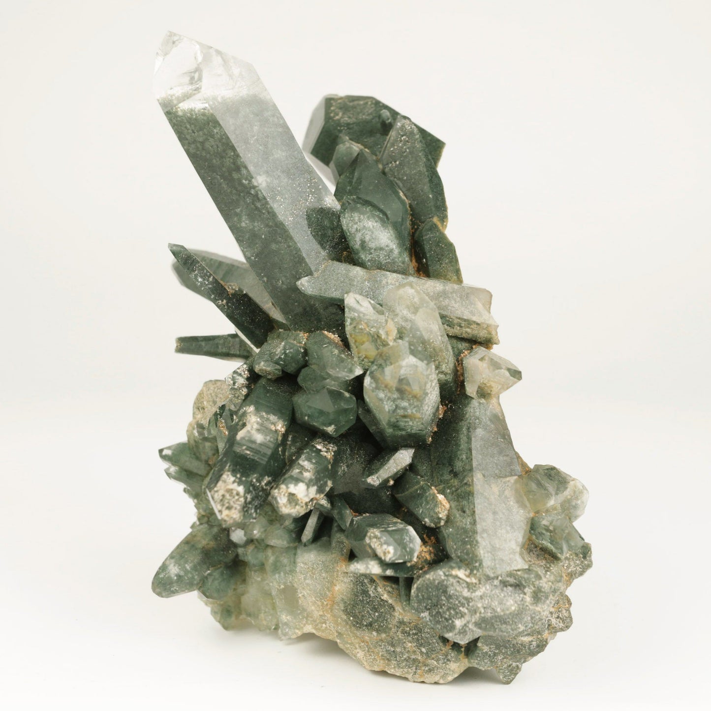 Quartz Gray Cluster Rare Find Natural Mineral Specimen # B 4856 https://www.superbminerals.us/products/quartz-gray-cluster-rare-find-natural-mineral-specimen-b-4856 Features: This Himalayan Quartz Cluster has a beautiful, aesthetically pleasing form and superb clarity.All the crystal individuals have shimmering Anatase minerals bonded to the facets, giving this cluster it's own unique appearance. The matrix is composed of lovely gray chlorite which gives the entire cluster