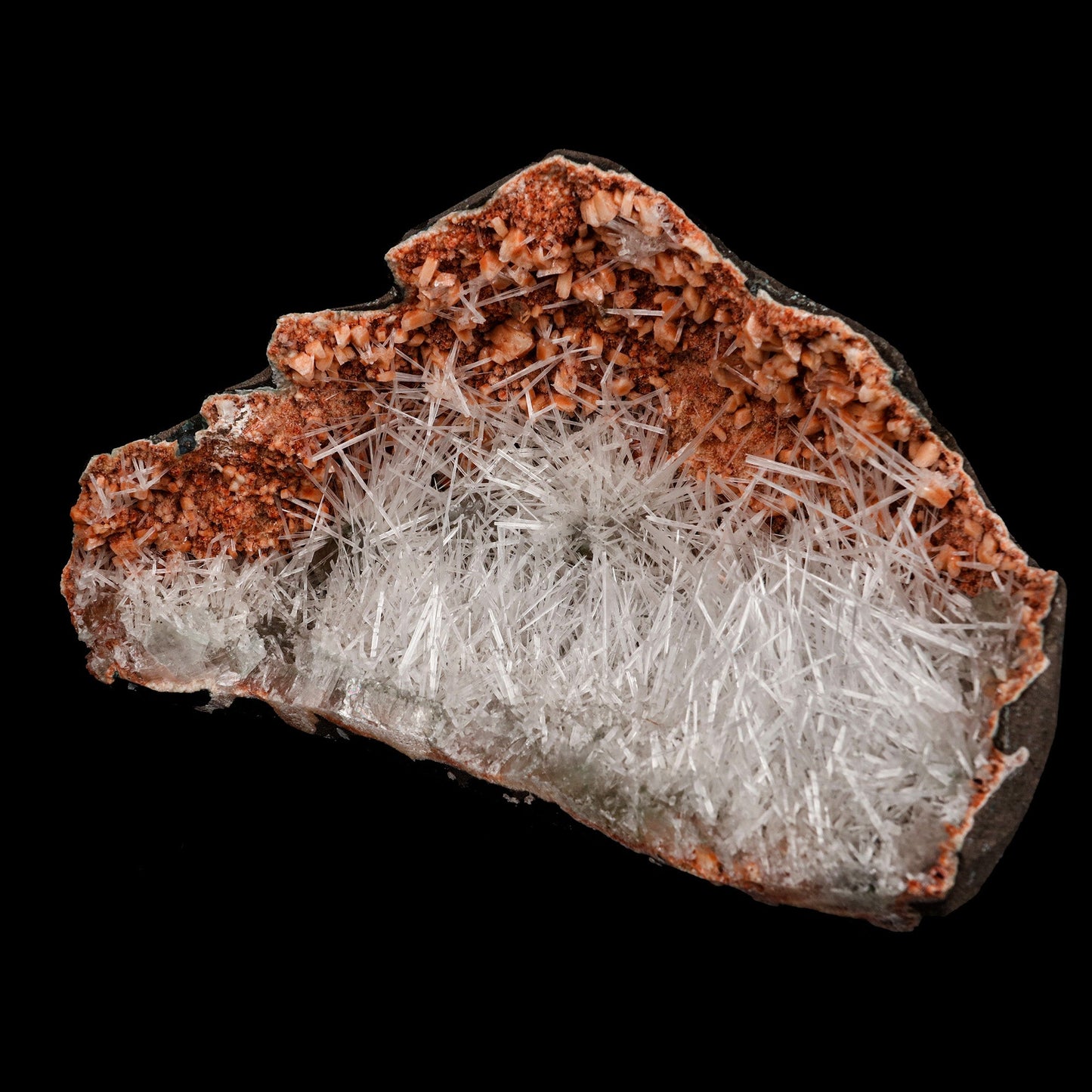 Scolecite Sprays Inside Heulandite Geode Natural Mineral Specimen # B…  https://www.superbminerals.us/products/scolecite-sprays-inside-heulandite-geode-natural-mineral-specimen-b-5276  Features: A beautiful display specimen from the Jalgaon Quarry in India consists of radial aggregates of white Scolecite aesthetically placed in a narrow crystal-lined vug. It was a bit of a challenge to photograph the piece, but in person, the piece is much better than the photos suggest. 