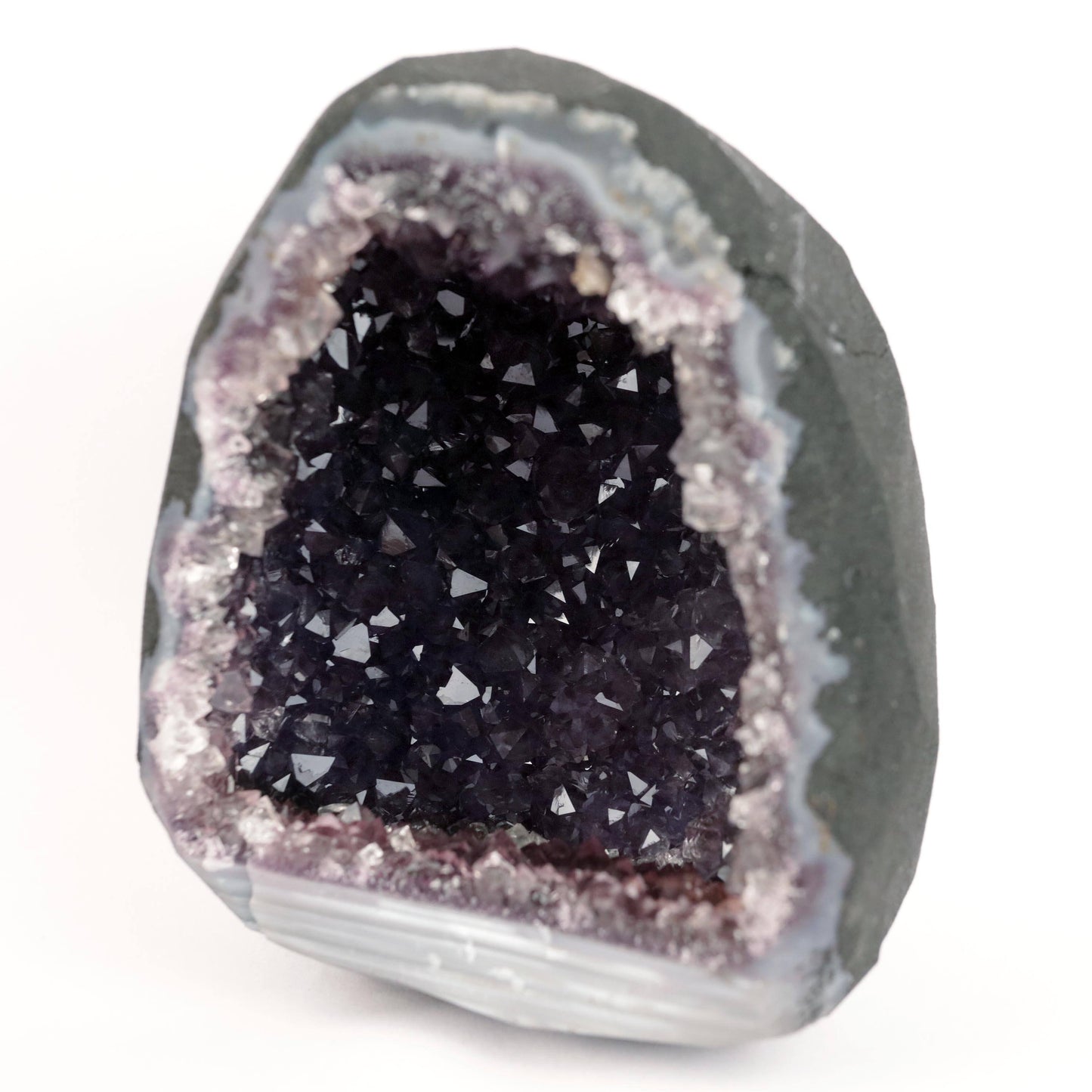 Sparkling Purple Amethyst Geode Natural Mineral Specimen # B 4636 https://www.superbminerals.us/products/sparkling-purple-amethyst-geode-natural-mineral-specimen-b-4636 Features: Large Amethyst Cluster with rich purple gems. Stunning Amethyst has a vibrant, rich hue and a brilliant sparkle. Besides its colour and brilliance, I chose this piece for its unusual and asymmetrical form. In a sea of identical-looking geodes, it stood out. I would recommend this as a decorative item.