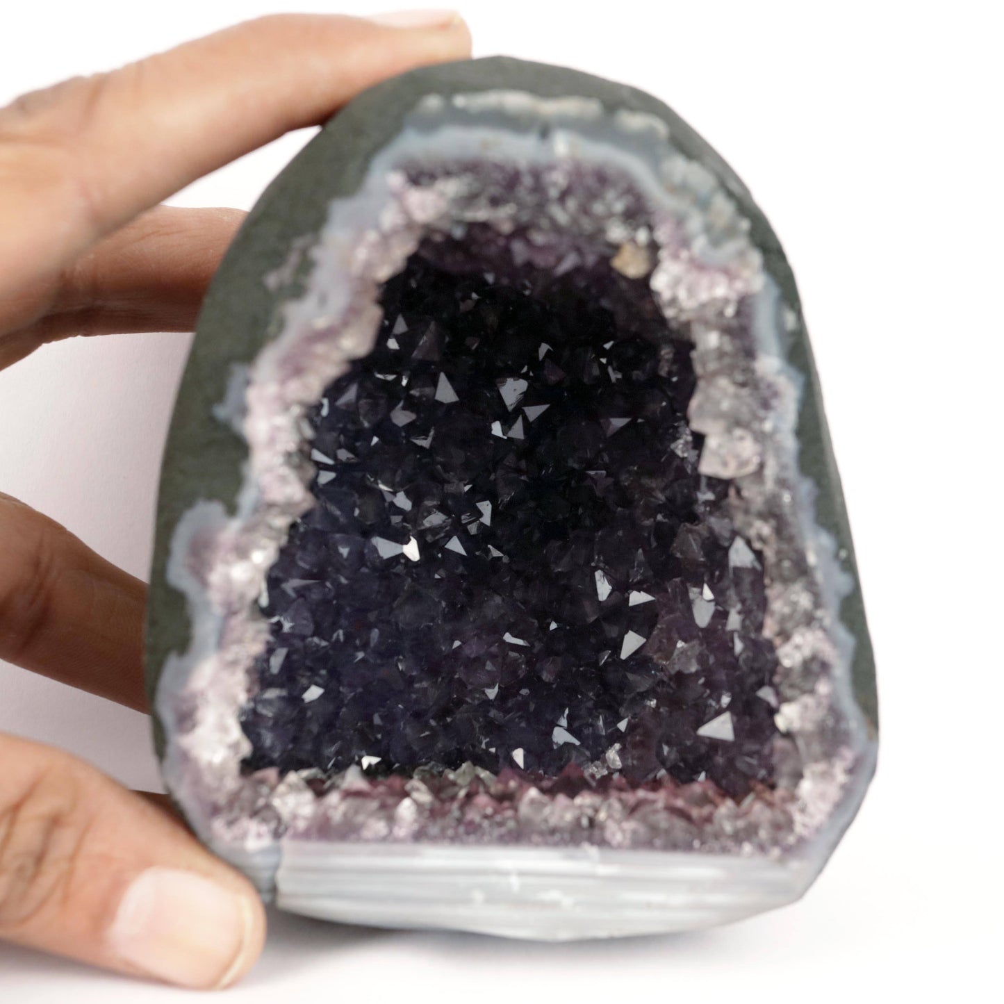 Sparkling Purple Amethyst Geode Natural Mineral Specimen # B 4636 https://www.superbminerals.us/products/sparkling-purple-amethyst-geode-natural-mineral-specimen-b-4636 Features: Large Amethyst Cluster with rich purple gems. Stunning Amethyst has a vibrant, rich hue and a brilliant sparkle. Besides its colour and brilliance, I chose this piece for its unusual and asymmetrical form. In a sea of identical-looking geodes, it stood out. I would recommend this as a decorative item.