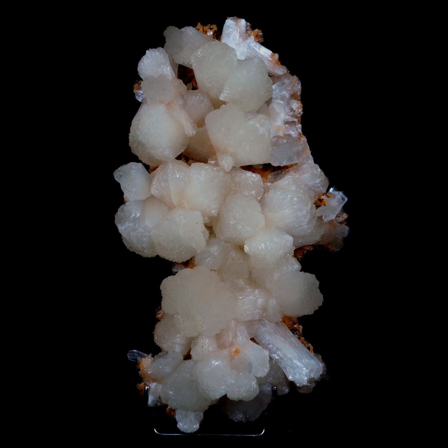 Stilbite on Heulandite Natural Mineral Specimen # B 4729 https://www.superbminerals.us/products/stilbite-on-heulandite-natural-mineral-specimen-b-4729 Features: Featuring many excellent quality bladed groups of Stilbite in a soft white hue, resting over pearly stalactitic formations of peach colored Heulandite, this piece is a stunning example of the material. The sculpture is really flashy and three-dimensional, and I particularly like how the Stilbites