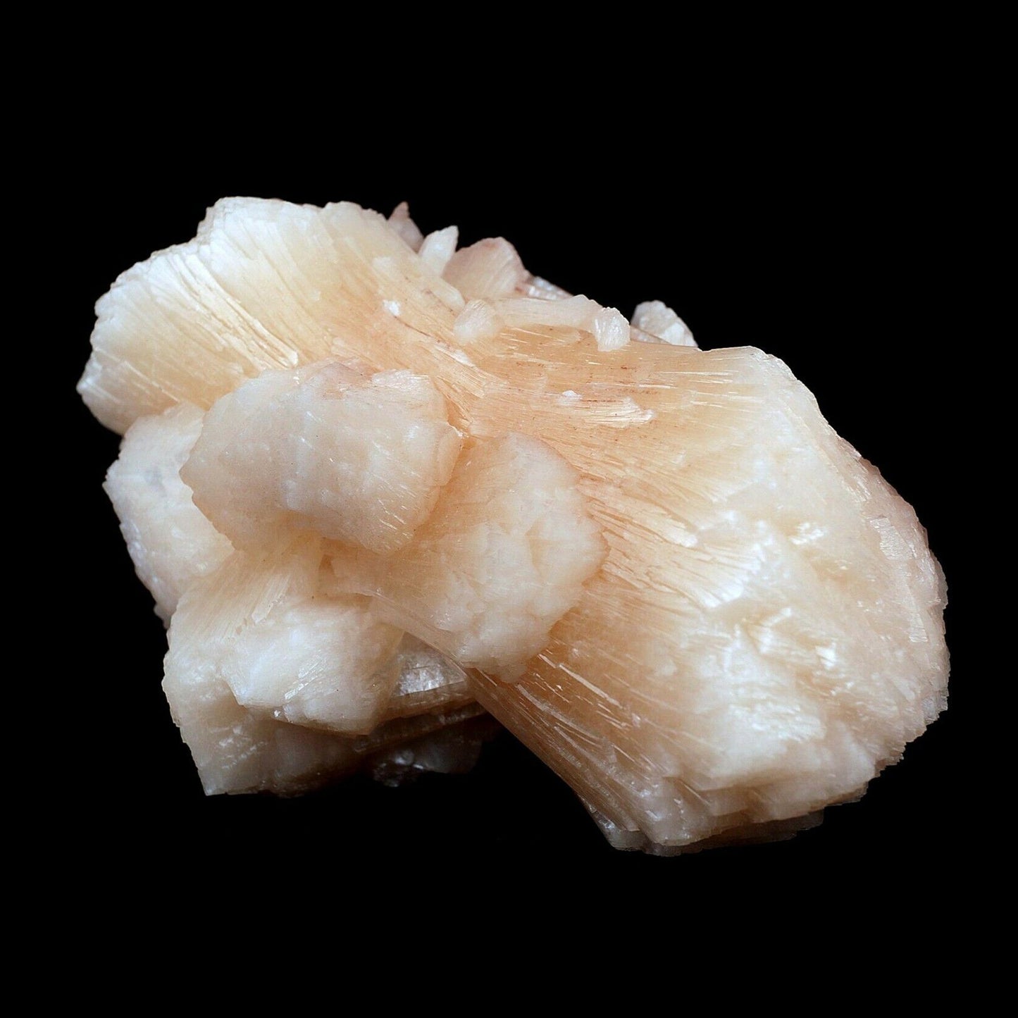 Stilbite Pink Crystal Natural Mineral Specimen # B 3642  https://www.superbminerals.us/products/stilbite-pink-crystal-natural-mineral-specimen-b-3642  Features:An exceptionally large cluster of Stilbite crystals in a classic bow tie formation along with numerous smaller Stilbite crystals on contrasting matrix. Primary Mineral(s): MM QuartzSecondary Mineral(s): StilbiteMatrix: N/A12 cm x 7 cm540 GmsLocality: Aurangabad, Maharashtra, IndiaYear of Discovery: 2020