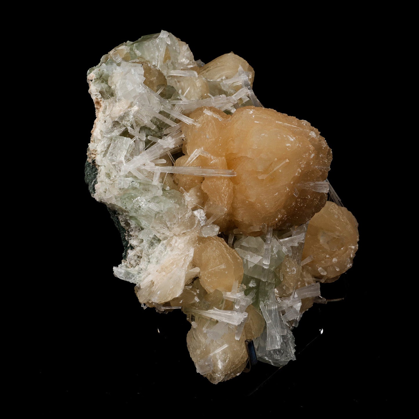 Stilbite with Scoecite Spray Apophyllite Natural Mineral Specimen # B… https://www.superbminerals.us/products/stilbite-with-scoecite-spray-apophyllite-natural-mineral-specimen-b-5232 Features: A very aesthetic combination piece featuring numerous large, lustrous green modified cubes on a dark-brown matrix hosting numerous acicular sprays of colorless to white, satiny Scolecite. Primary Mineral(s): StilbiteSecondary Mineral(s): Apophyllite, ScoleciteMatrix: N/A 7 Inch x 6 InchWeight : 1410