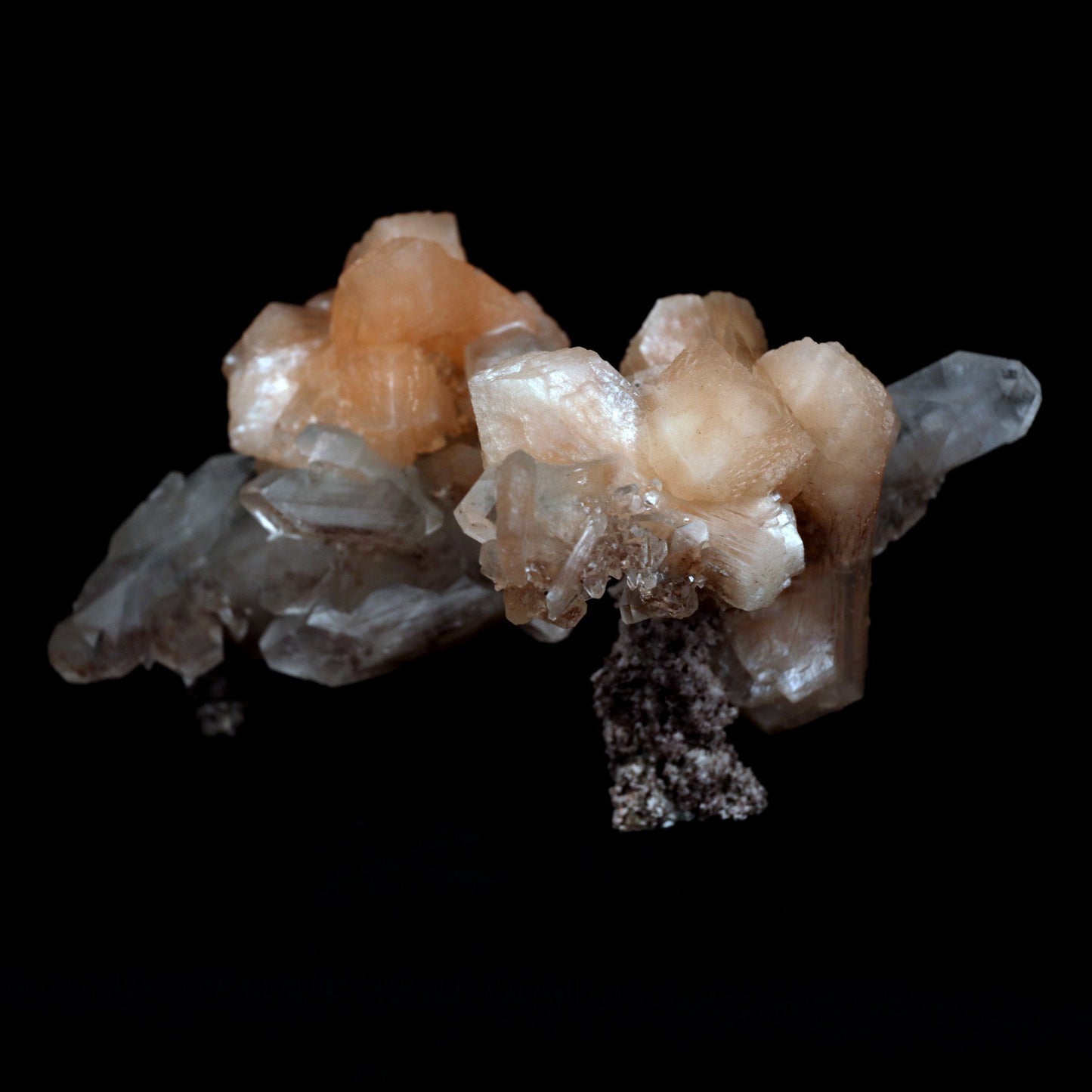 Terminated Stilbite with Apophyllite Natural Mineral Specimen # B 480… https://www.superbminerals.us/products/terminated-stilbite-with-apophyllite-natural-mineral-specimen-b-4802 Features: Beautiful, classic salmon-pink, iridescent, translucent stilbite blades form a dramatic and sculptural huge two-sided specimen from Jalgaon, with sprakling Apophyllite crystals.The huge doubly ended bowtie on the back is eye-catching. The wormy, green celadonite-infused chalcedony matrix
