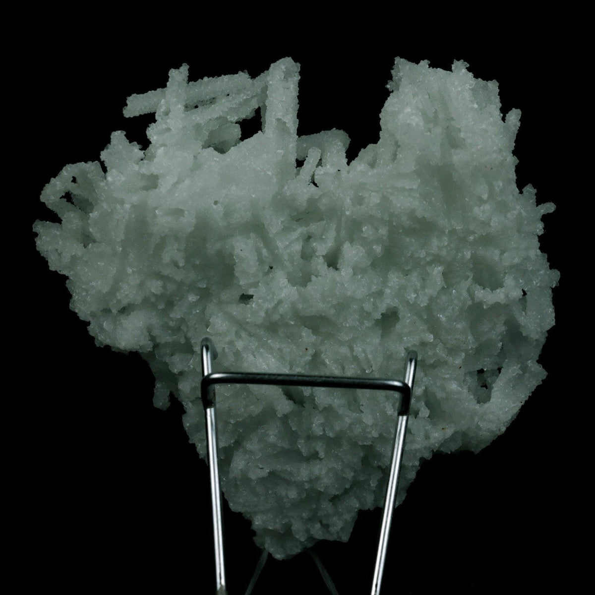 Prehnite Rare Find Natural Mineral Specimen # B 4754  https://www.superbminerals.us/products/prehnite-rare-find-natural-mineral-specimen-b-4754  Features: A coveted jackstraw cluster of elongated laumontite crystals that pseudomorphed from mint-green