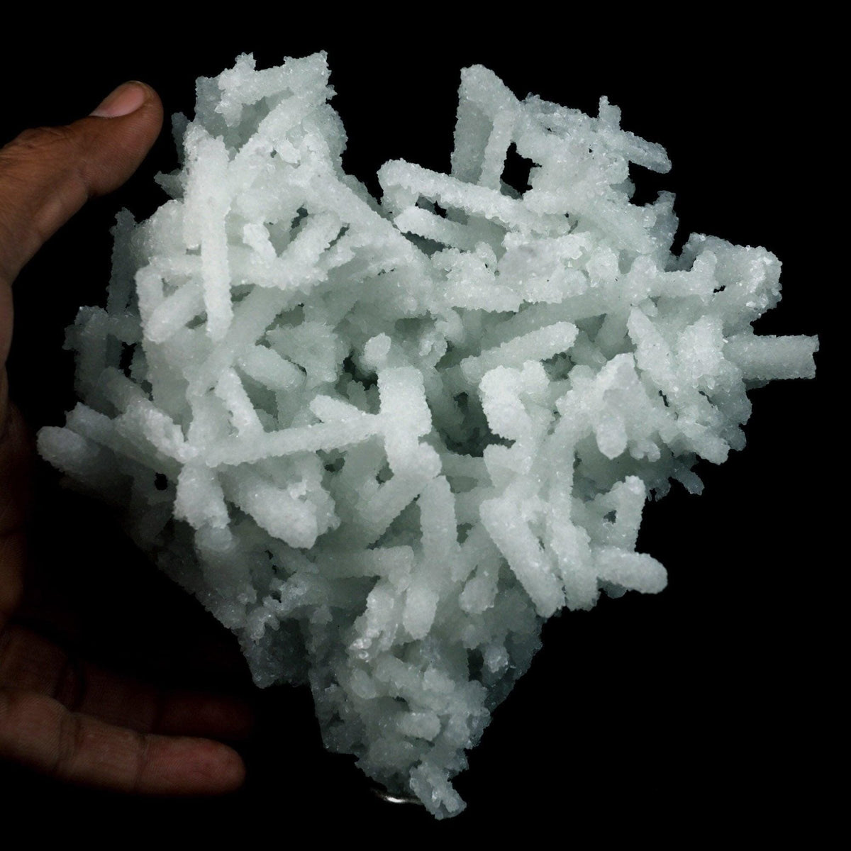 Prehnite Rare Find Natural Mineral Specimen # B 4754  https://www.superbminerals.us/products/prehnite-rare-find-natural-mineral-specimen-b-4754  Features: A coveted jackstraw cluster of elongated laumontite crystals that pseudomorphed from mint-green