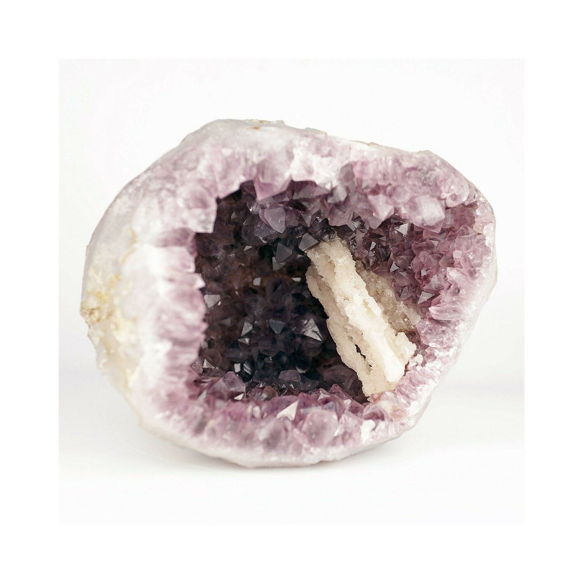 Amethyst purple geod formation with Calcite Natural Mineral Specimen # b3669 An Amethyst Quartz Geode from India! The Amethyst is lustrous and a unique purple color on a colorless Chalcedony. There is banding clearly present on the opening edge, and there is a unique thin reddish-brown streak around the inside of the geode due to a self-healed fracture on the outside of the geode.