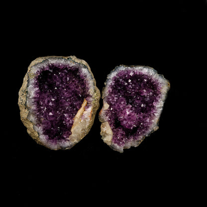 Amethyst Geode with Calcite Unopened Natural Mineral Specimen # B 522…  https://www.superbminerals.us/products/amethyst-geode-with-calcite-unopened-natural-mineral-specimen-b-5226  Features: This essay highlights the importance of never judging a book by its cover. When you look at these two halves together, it's plain and unappealing. Even unappealing. It's a breathtaking contrast to see the sparkling, purple Amethyst crystals lining the entire chamber on both half as it splits apart!