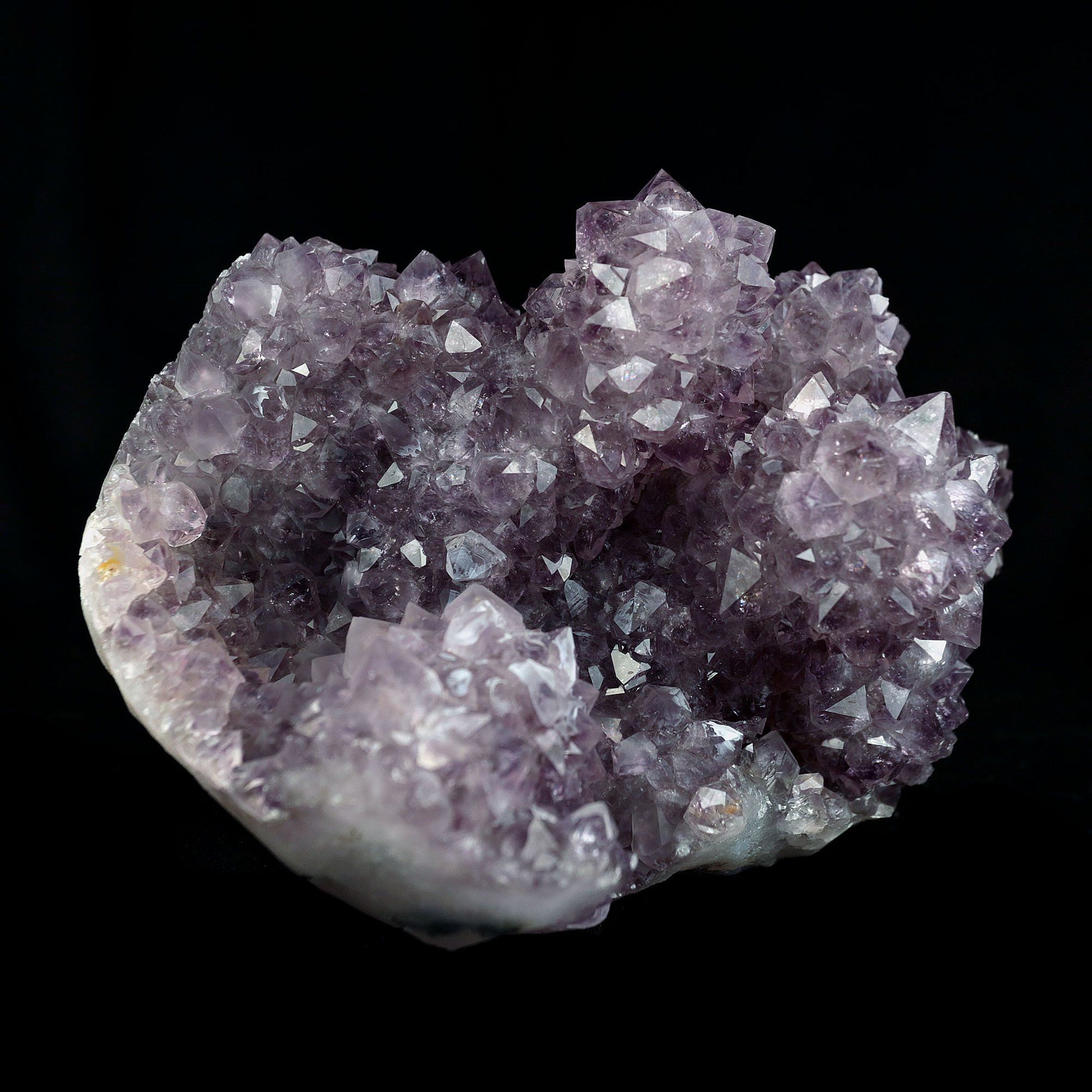 Amethyst Purple Color Crystal Natural Mineral Specimen # B 4092  https://www.superbminerals.us/products/amethyst-purple-color-crystal-natural-mineral-specimen-b-4092  Features:A very large Geode fragment lined with black bubbled&nbsp; Chalcedony, partially coated with a sparkling colorless Chalcedony druse. There is another, smaller bubuled crystal near a corner, but it’s the pristine, centered that steals the show! The luster, contrast, crystal formation and balance is outstanding