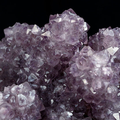 Amethyst Purple Color Crystal Natural Mineral Specimen # B 4092  https://www.superbminerals.us/products/amethyst-purple-color-crystal-natural-mineral-specimen-b-4092  Features:A very large Geode fragment lined with black bubbled&nbsp; Chalcedony, partially coated with a sparkling colorless Chalcedony druse. There is another, smaller bubuled crystal near a corner, but it’s the pristine, centered that steals the show! The luster, contrast, crystal formation and balance is outstanding
