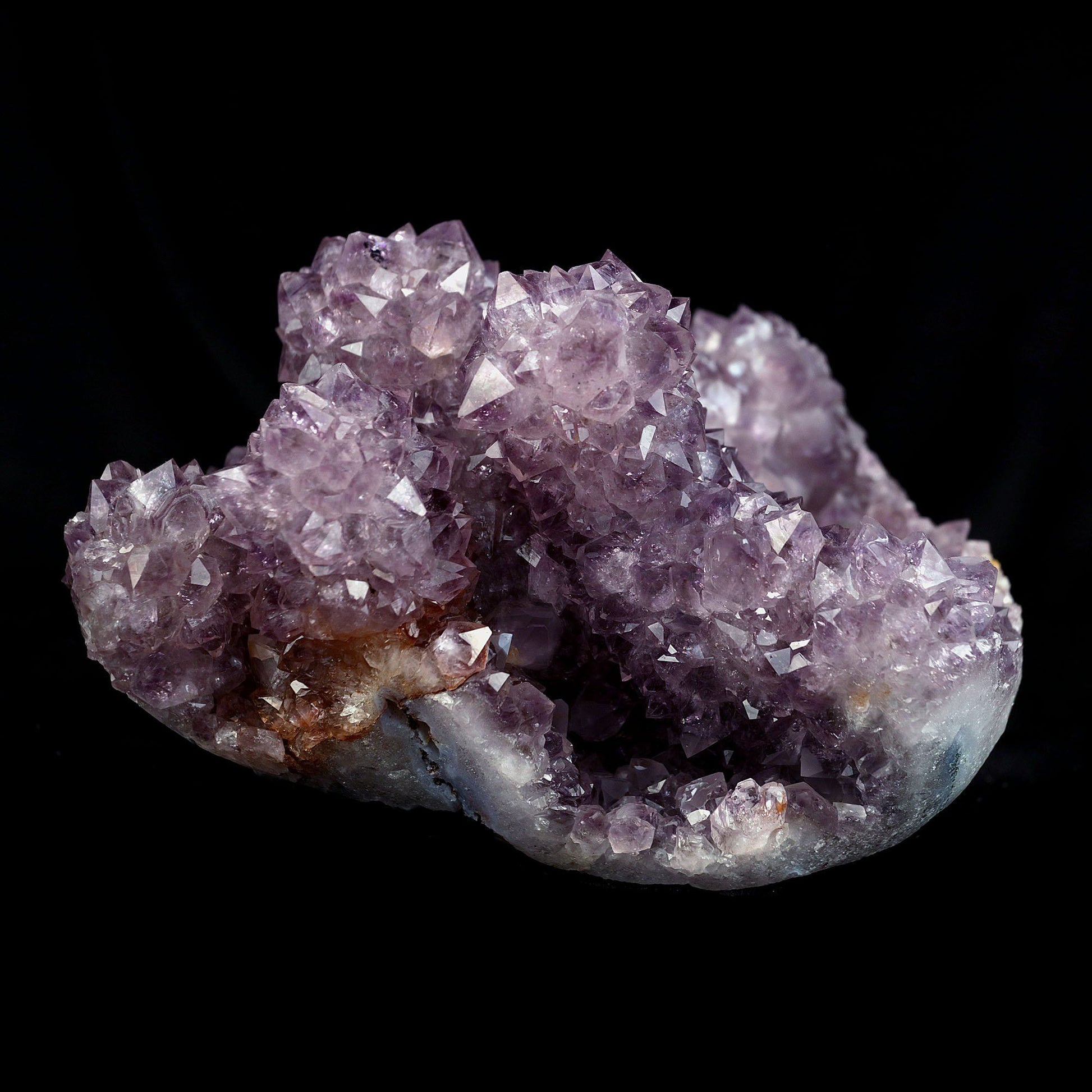 Amethyst Purple Color Crystal Natural Mineral Specimen # B 4092  https://www.superbminerals.us/products/amethyst-purple-color-crystal-natural-mineral-specimen-b-4092  Features:A very large Geode fragment lined with black bubbled&nbsp; Chalcedony, partially coated with a sparkling colorless Chalcedony druse. There is another, smaller bubuled crystal near a corner, but it’s the pristine, centered that steals the show! The luster, contrast, crystal formation and balance is outstanding