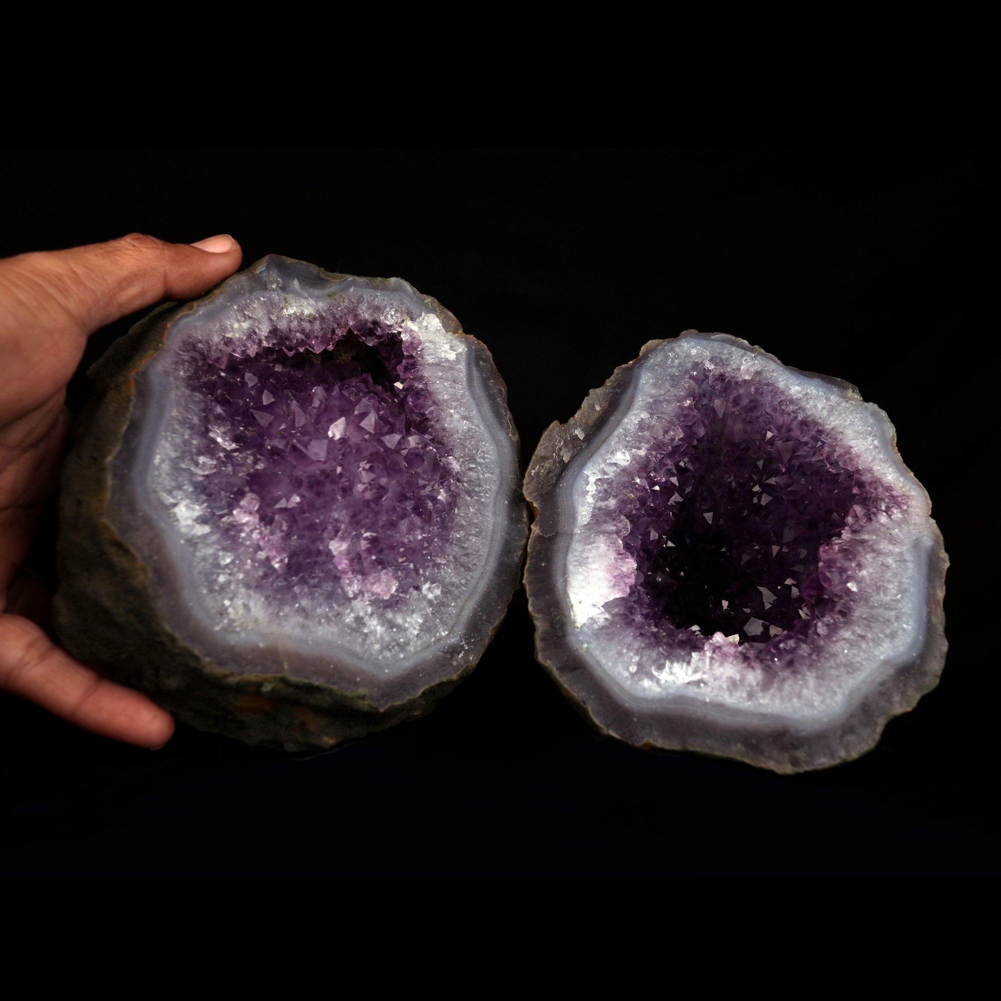 Amethyst Purple Crystals Geode (2 Halves ) Natural Mineral Specimen # …  https://www.superbminerals.us/products/amethyst-purple-crystals-geode-2-halves-natural-mineral-specimen-b-4816  Features: An extremely stylish piece highlighting two parts of an Amethyst Geode. The Amethyst crystals are on a Quartz which itself is on layers of clear, dark/blue Chalcedony. The tone, shine and differentiation is astonishing. Furthermore, to see two coordinated parts showed is an eye-catcher. 