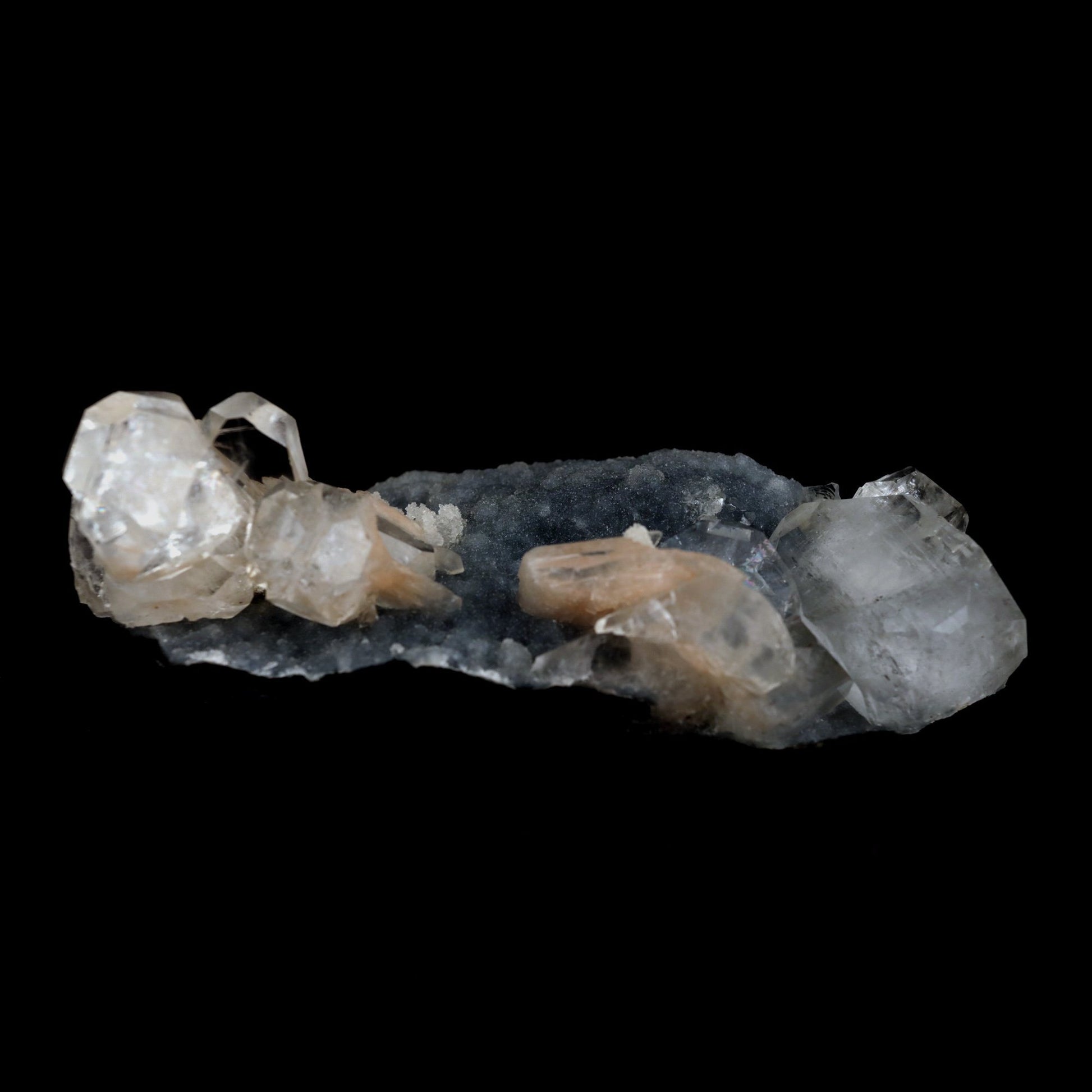 Apophyllite Cube with Stilbite on Chalcedony Natural Mineral Specimen …  https://www.superbminerals.us/products/apophyllite-cube-with-stilbite-on-chalcedony-natural-mineral-specimen-b-4916  Features: Beautiful, isolated, cubical, lustrous, gemmy, colorless / white crystals of Apophyllite sit beautifully on the sparkling black Chalcedony matrix. A few blades of Stilbite can be seen on the piece as well. Most of the Apophyllites are completely damage fee, and show such a lovely "wet" luster