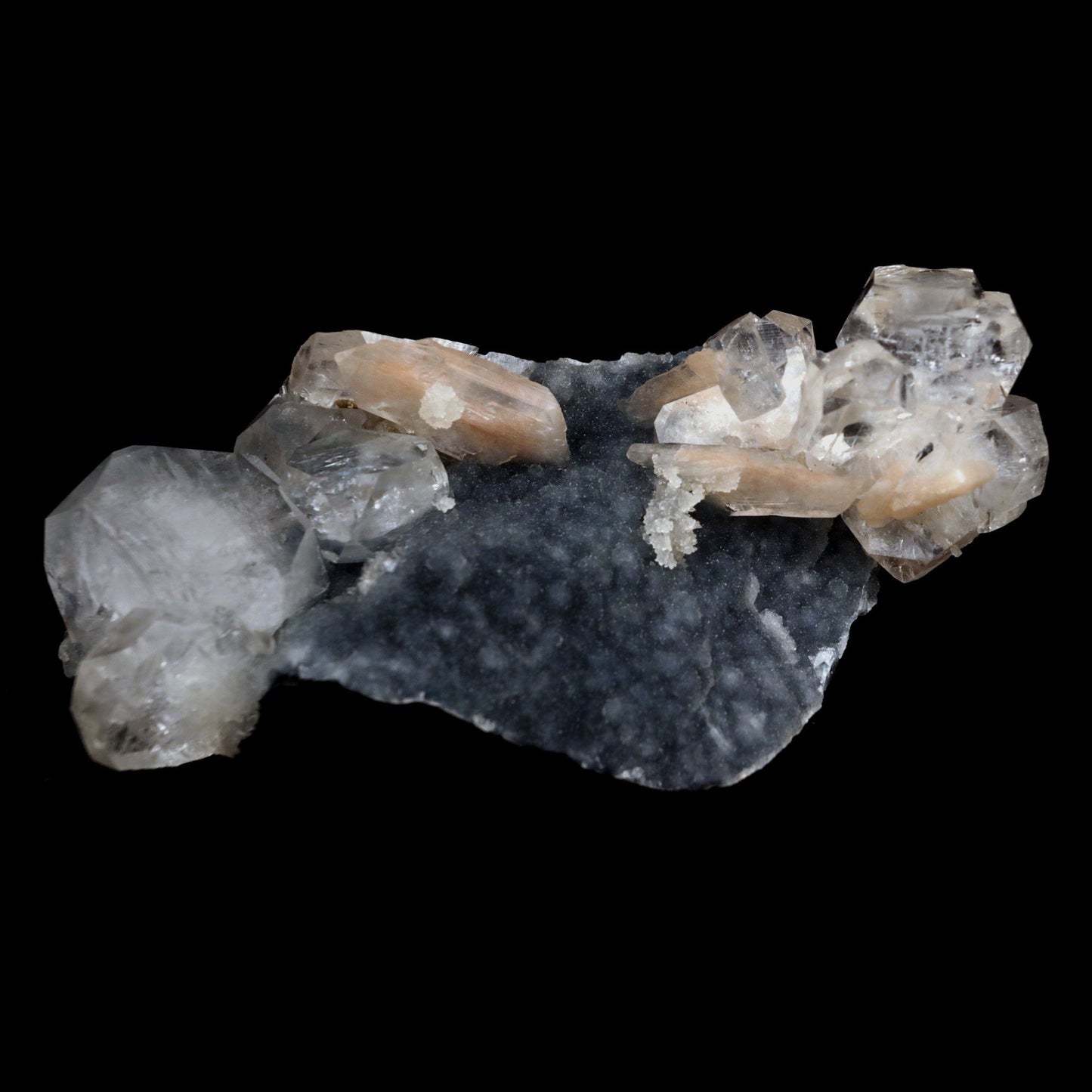Apophyllite Cube with Stilbite on Chalcedony Natural Mineral Specimen …  https://www.superbminerals.us/products/apophyllite-cube-with-stilbite-on-chalcedony-natural-mineral-specimen-b-4916  Features: Beautiful, isolated, cubical, lustrous, gemmy, colorless / white crystals of Apophyllite sit beautifully on the sparkling black Chalcedony matrix. A few blades of Stilbite can be seen on the piece as well. Most of the Apophyllites are completely damage fee, and show such a lovely "wet" luster