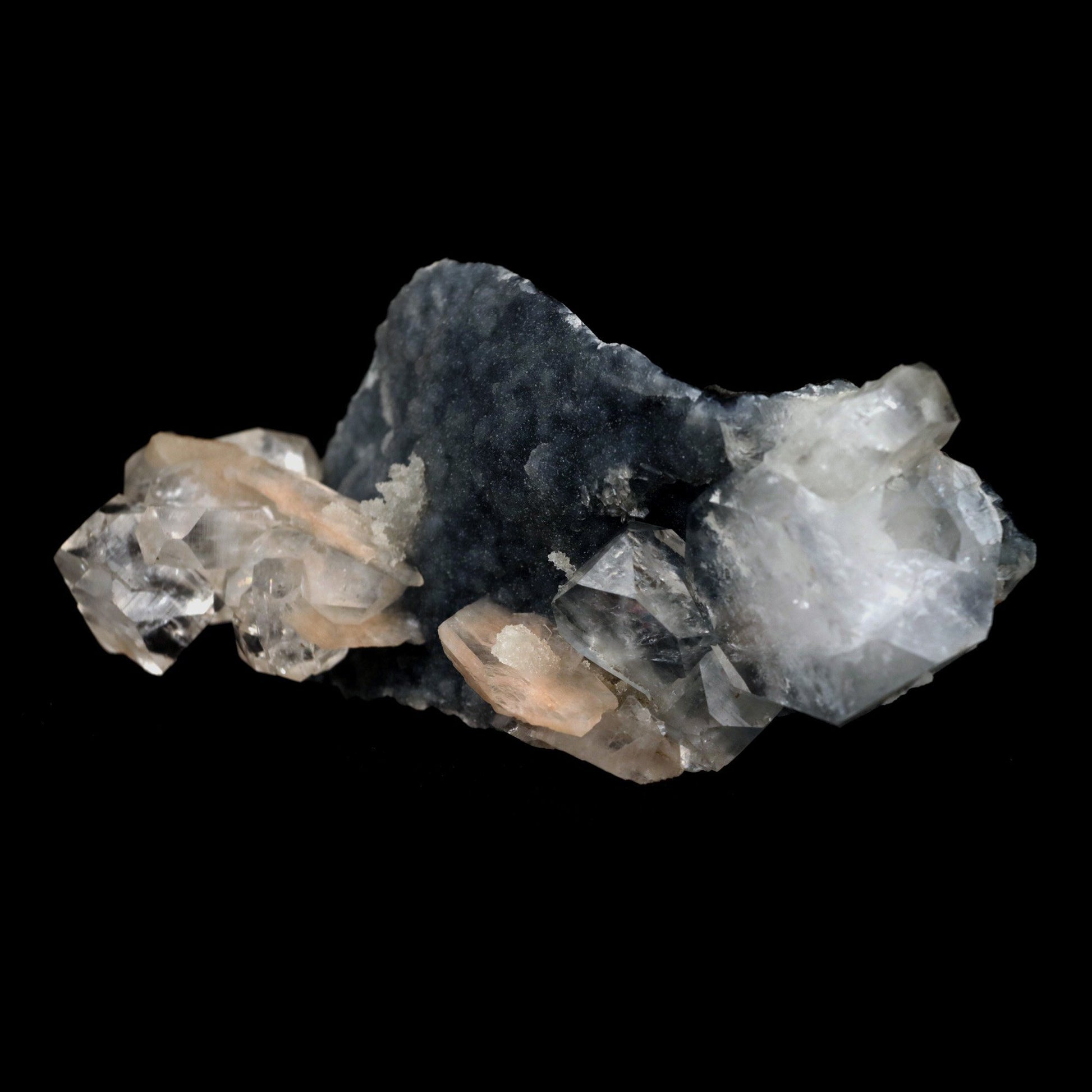 Apophyllite Cube with Stilbite on Chalcedony Natural Mineral Specimen …  https://www.superbminerals.us/products/apophyllite-cube-with-stilbite-on-chalcedony-natural-mineral-specimen-b-4916  Features: Beautiful, isolated, cubical, lustrous, gemmy, colorless / white crystals of Apophyllite sit beautifully on the sparkling black Chalcedony matrix. A few blades of Stilbite can be seen on the piece as well. Most of the Apophyllites are completely damage fee, and show such a lovely "wet" luster