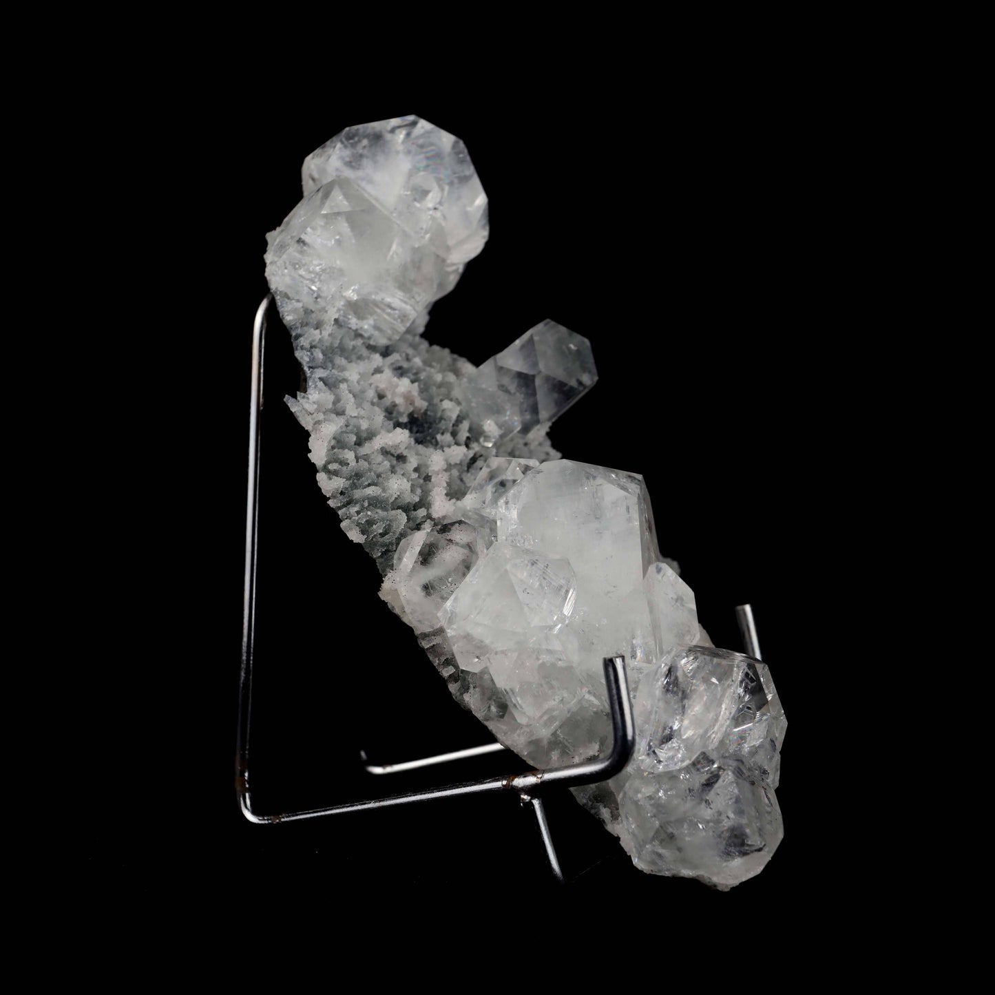 Apophyllite Cubes on Chalacedony Natural Mineral Specimen # B 4954  https://www.superbminerals.us/products/apophyllite-cubes-on-chalacedony-natural-mineral-specimen-b-4954  Features:Beautiful, solitary, crisp, glossy, gemmy, colourless / white crystals of Apophyllite sit elegantly on the underlying matrix.Most of the Apophyllites are fully damage fee, and show such a gorgeous "wet" sheen with a bit of zoning as the centres of the crystals are a bit more opaque than the outer edges,