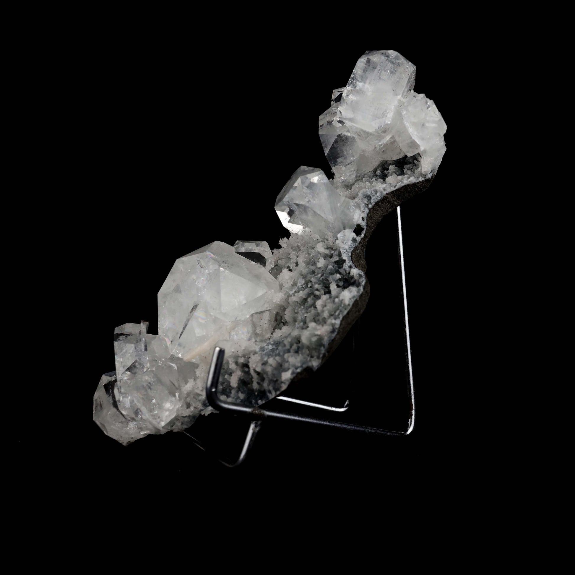 Apophyllite Cubes on Chalacedony Natural Mineral Specimen # B 4954  https://www.superbminerals.us/products/apophyllite-cubes-on-chalacedony-natural-mineral-specimen-b-4954  Features:Beautiful, solitary, crisp, glossy, gemmy, colourless / white crystals of Apophyllite sit elegantly on the underlying matrix.Most of the Apophyllites are fully damage fee, and show such a gorgeous "wet" sheen with a bit of zoning as the centres of the crystals are a bit more opaque than the outer edges,