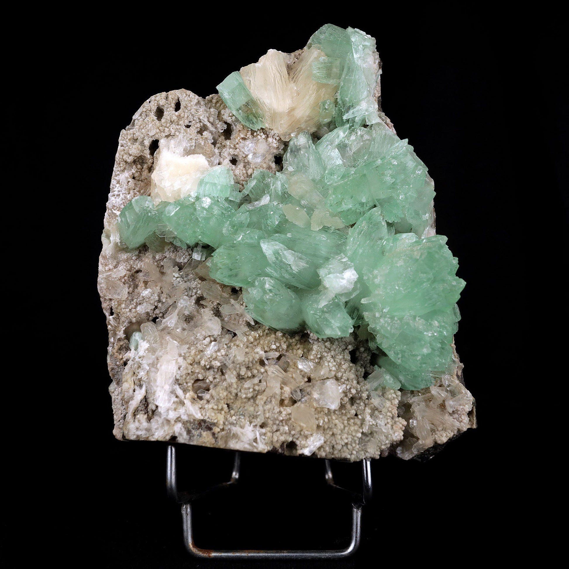 Apophyllite Green Crystal with Stilbite Natural Mineral Specimen # B3716 https://www.superbminerals.us/products/apophyllite-green-crystal-with-stilbite-natural-mineral-specimen-b-3716 A very aesthetic piece featuring a matrix densely coated with miniature, Stilbite crystals with a couple of lustrous, larger light Stilbite crystals on matrix, all hosting a line of transparent, mint-green Apophyllite pseudocubic (rectangular) crystals ascending to the top of the piece. Great contrast,