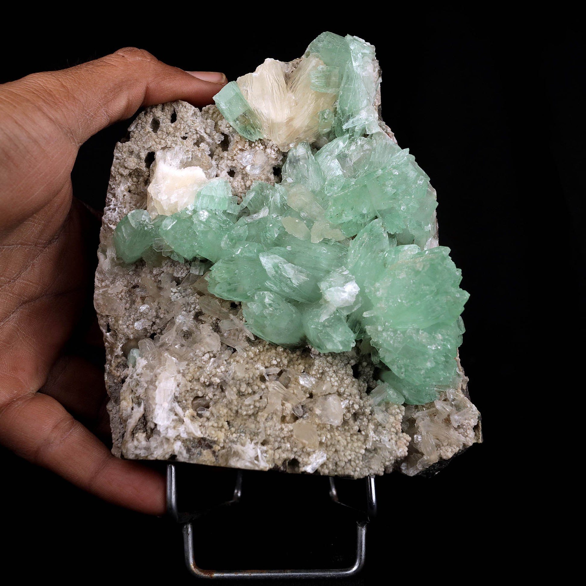 Apophyllite Green Crystal with Stilbite Natural Mineral Specimen # B3716 https://www.superbminerals.us/products/apophyllite-green-crystal-with-stilbite-natural-mineral-specimen-b-3716 A very aesthetic piece featuring a matrix densely coated with miniature, Stilbite crystals with a couple of lustrous, larger light Stilbite crystals on matrix, all hosting a line of transparent, mint-green Apophyllite pseudocubic (rectangular) crystals ascending to the top of the piece. Great contrast,